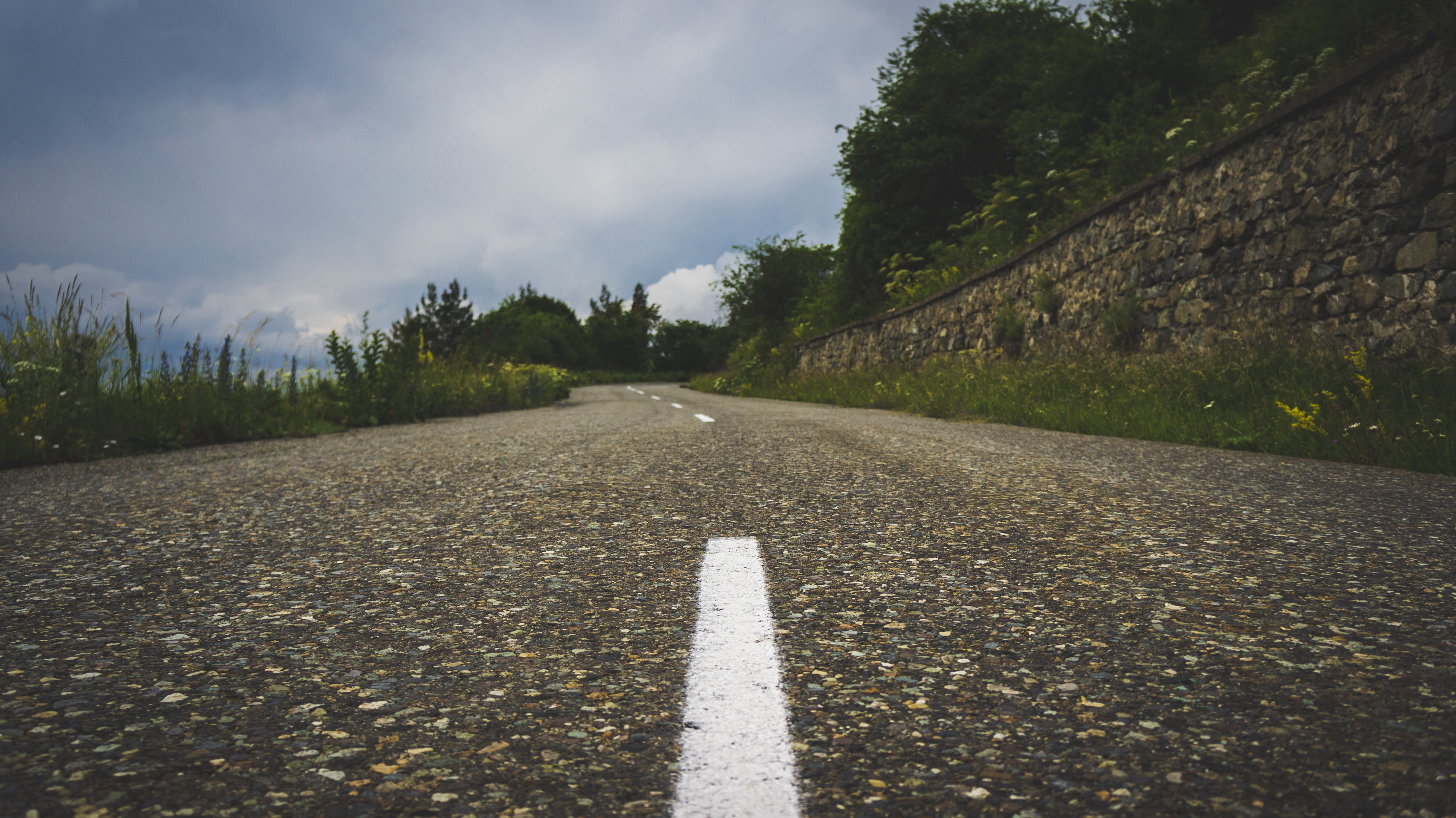 Road in Armenia with Stone Wall and Clouds HD Wallpaper