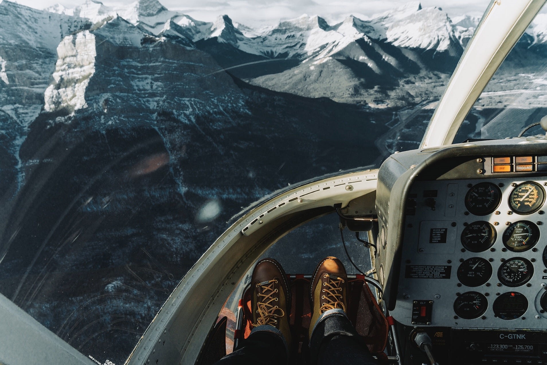 Helicopter cockpit view of snowy mountains HD Wallpaper