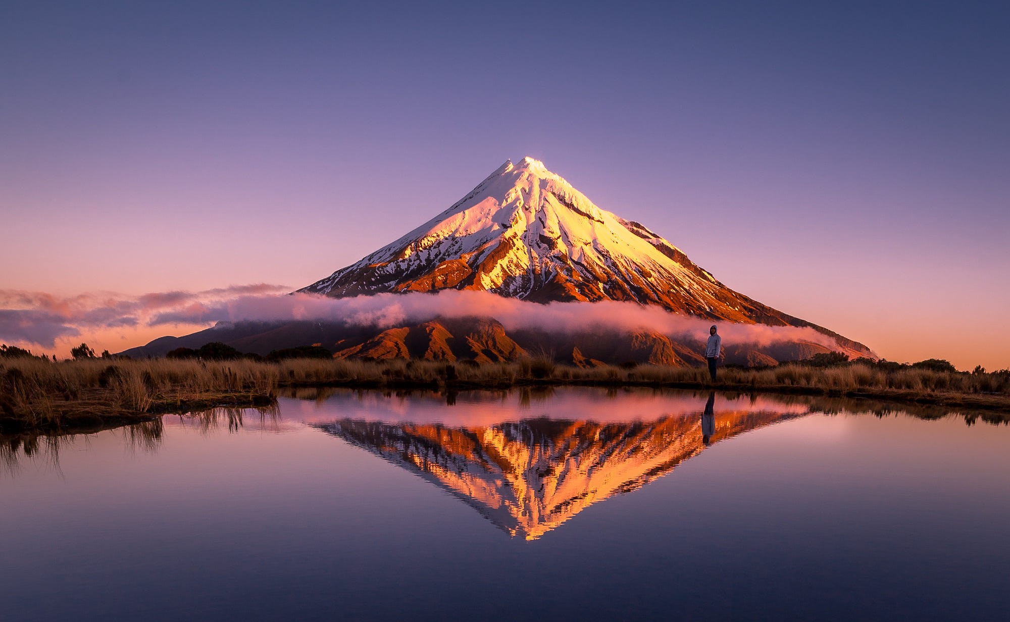 Mount Taranaki reflected in a lake at sunrise HD Wallpaper