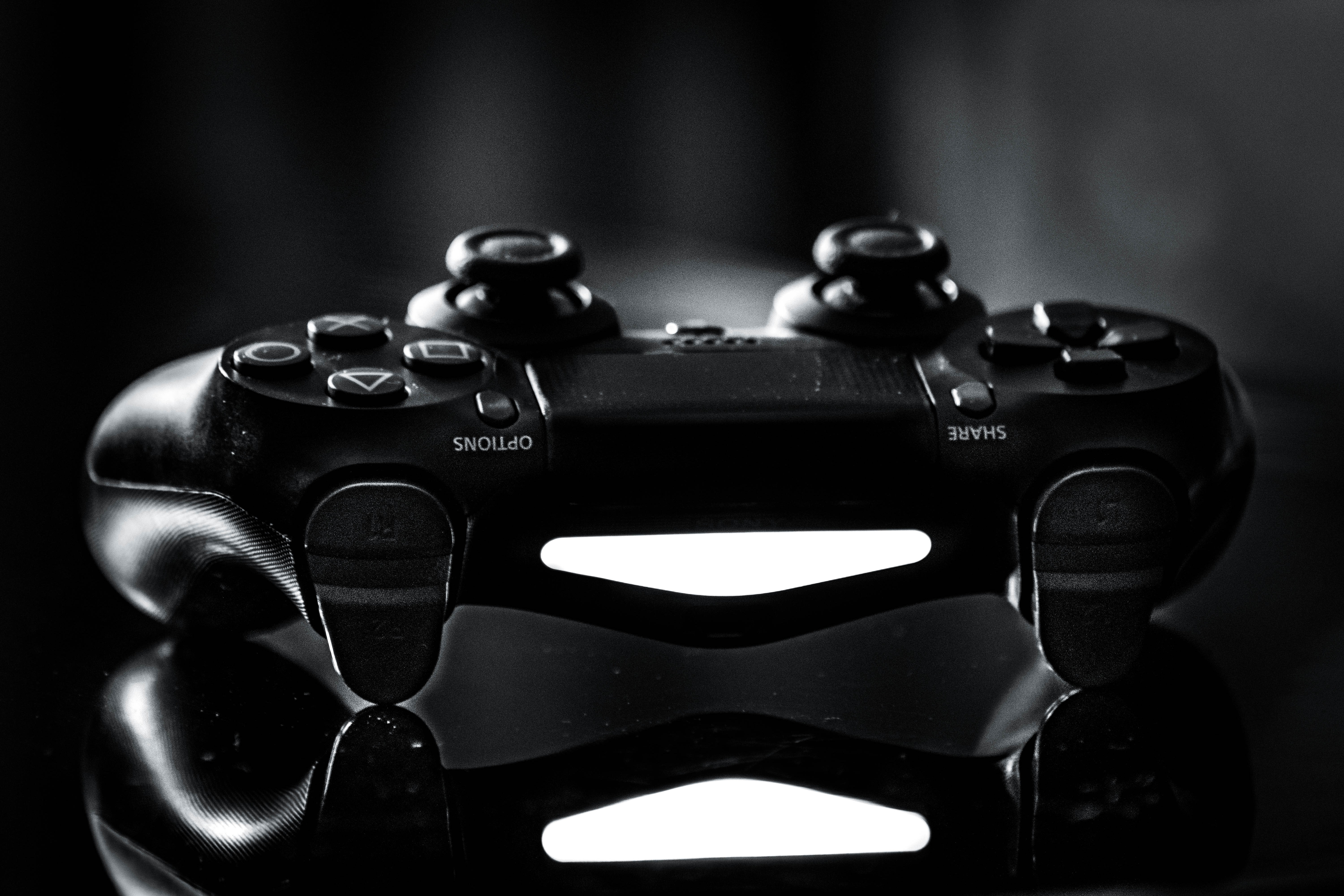PlayStation 4 DualShock 4 controller in monochrome HD Wallpaper