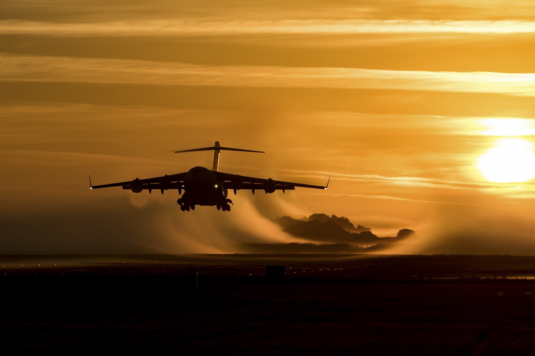 Boeing C-17 Globemaster III taking off at sunrise HD Wallpaper