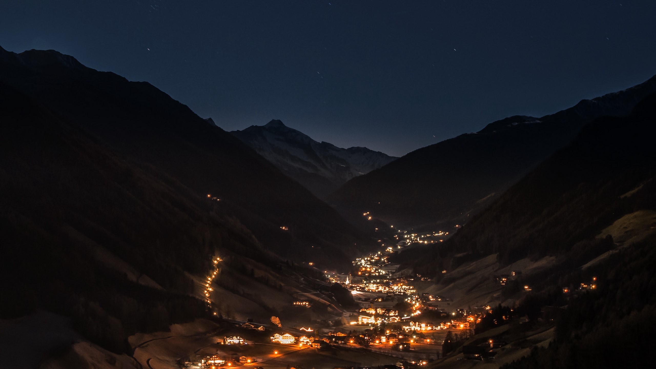 Mountain valley village at night with starry sky HD Wallpaper