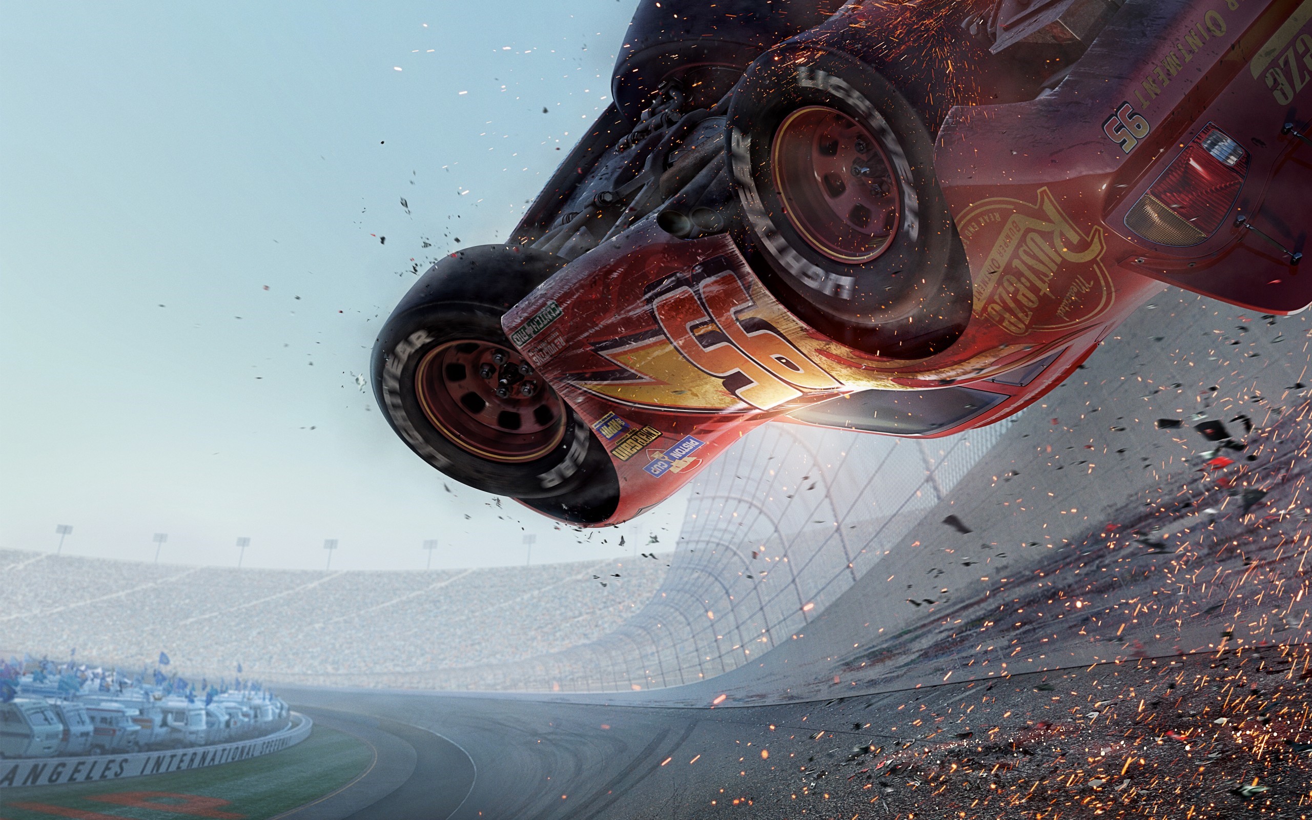 Lightning McQueen from Cars 3 crashing on a racetrack HD Wallpaper