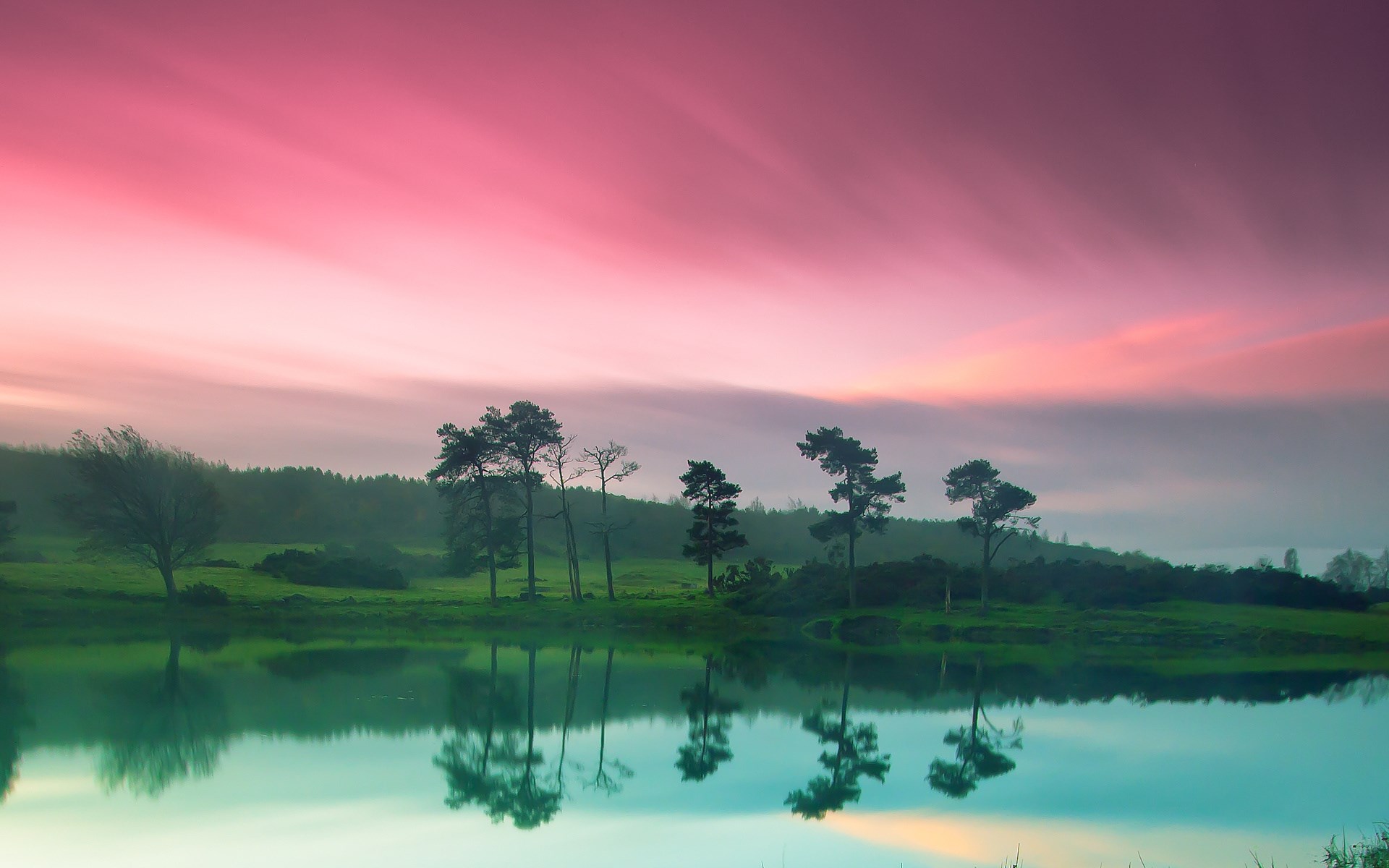 Pink sky over a lake with trees and reflections HD Wallpaper