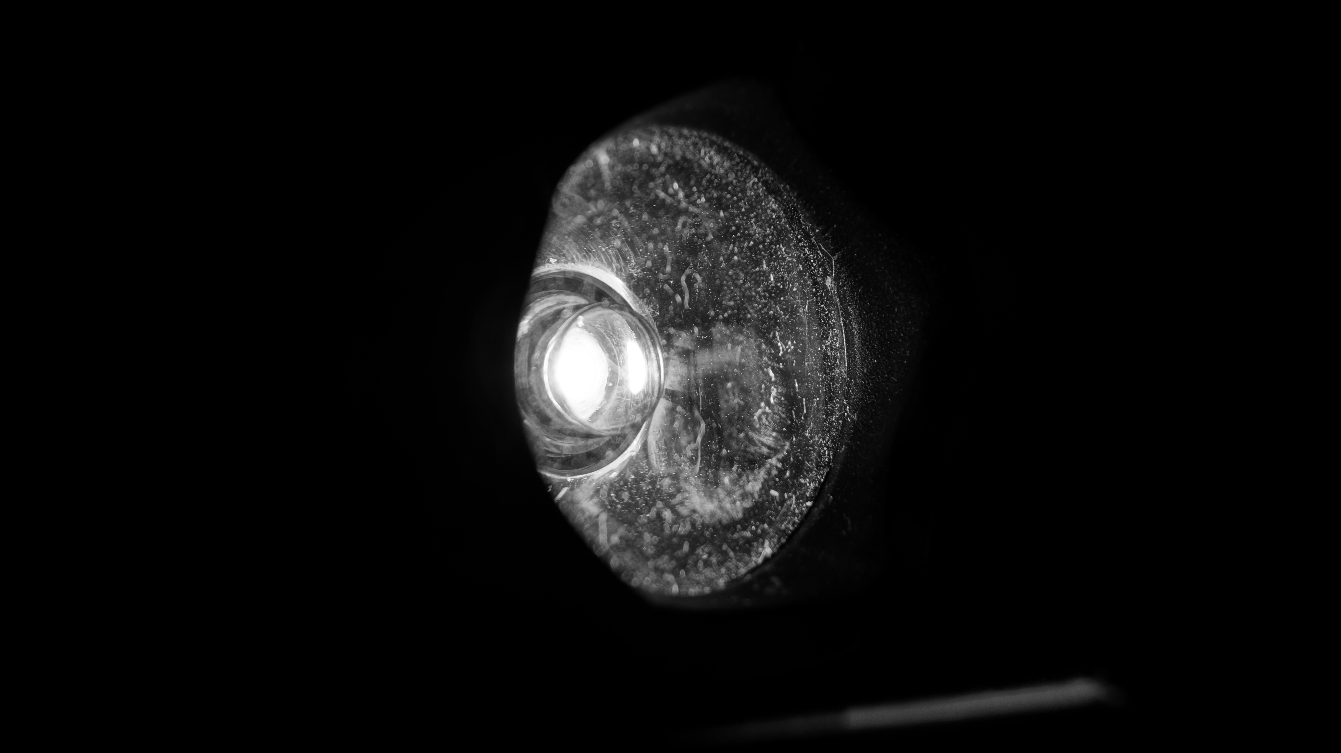 Close-up of a flashlight lens with light HD Wallpaper
