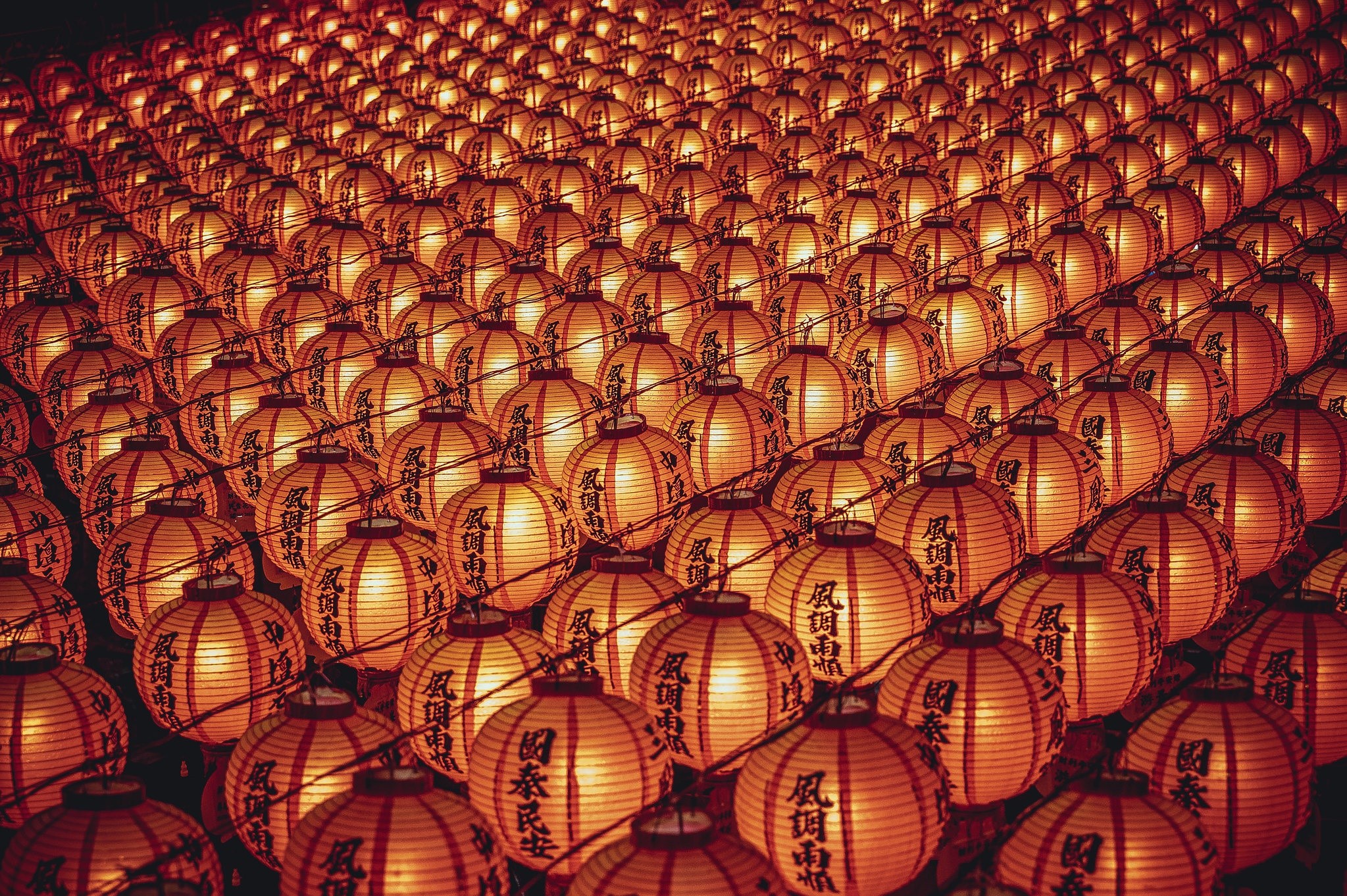 Rows of illuminated orange lanterns HD Wallpaper