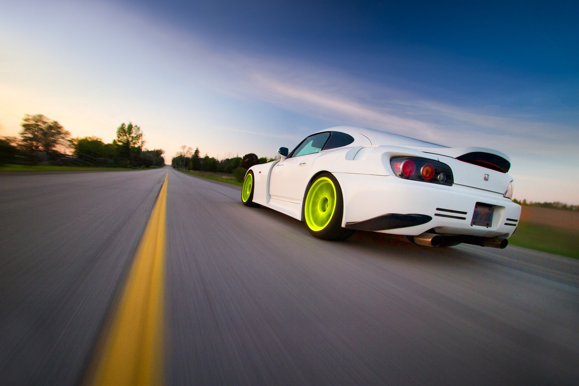 White Honda S2000 driving on a road at sunset HD Wallpaper