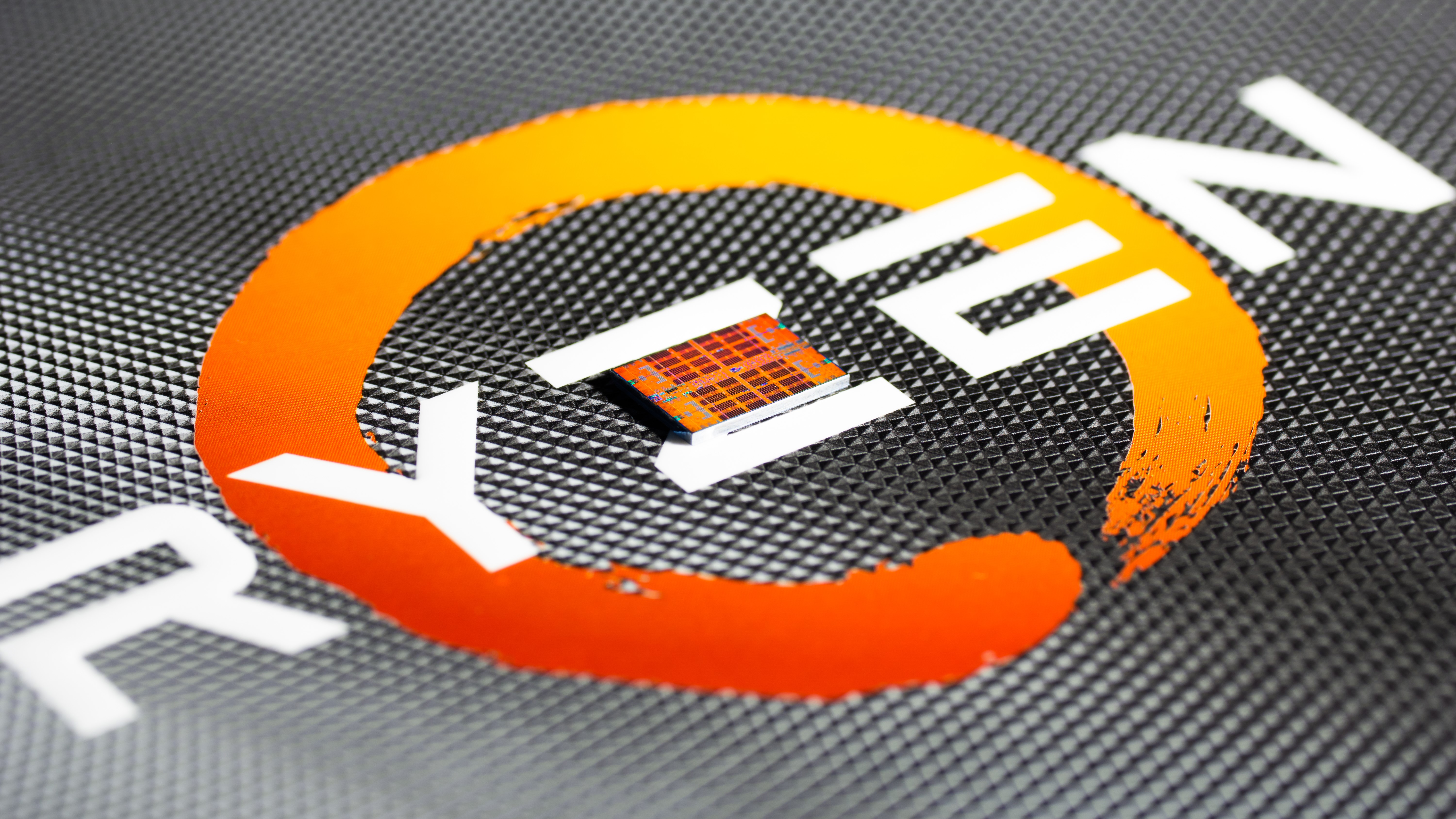 AMD Ryzen CPU on a textured surface HD Wallpaper