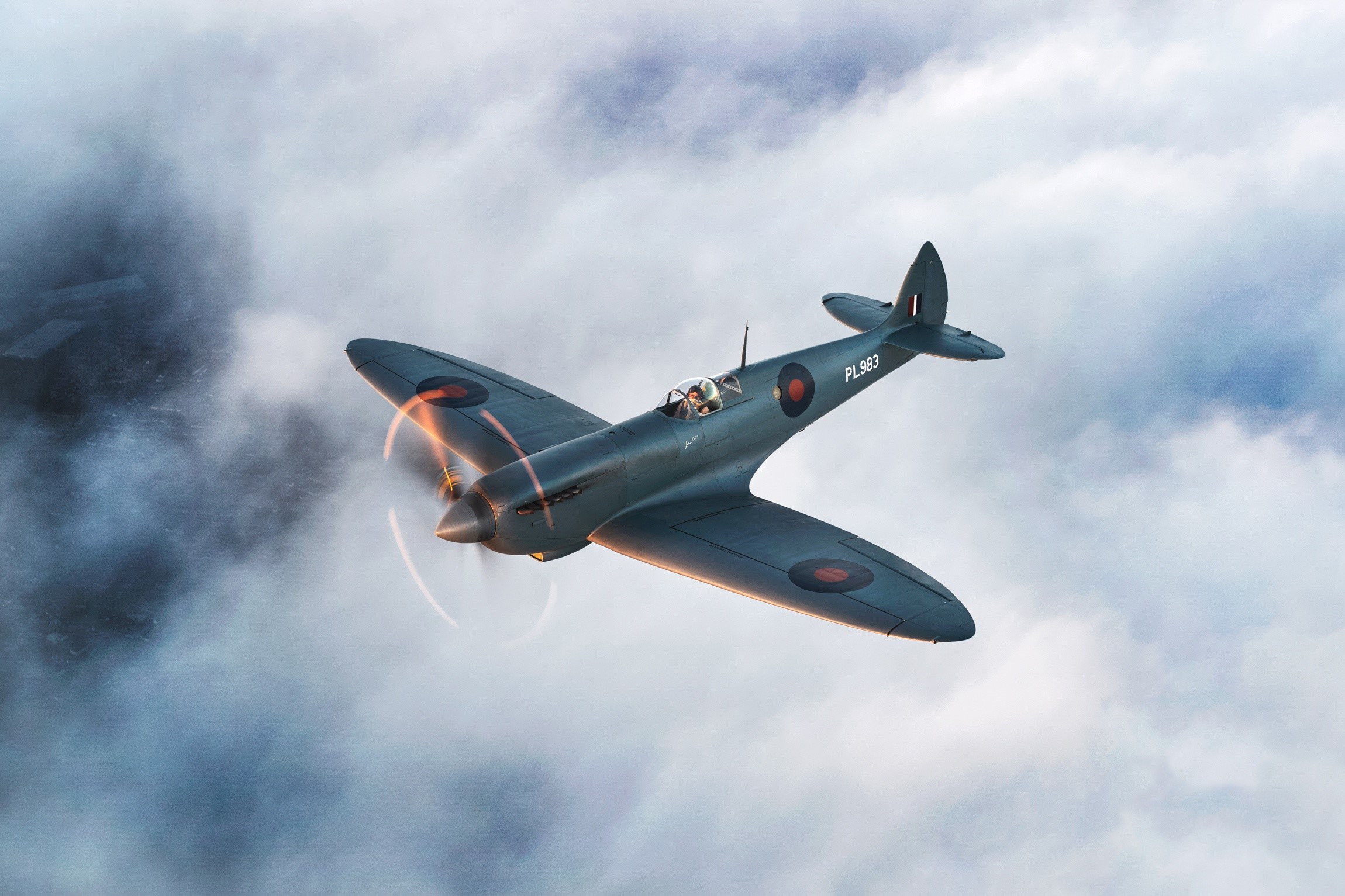 Supermarine Spitfire PL983 flying through clouds HD Wallpaper