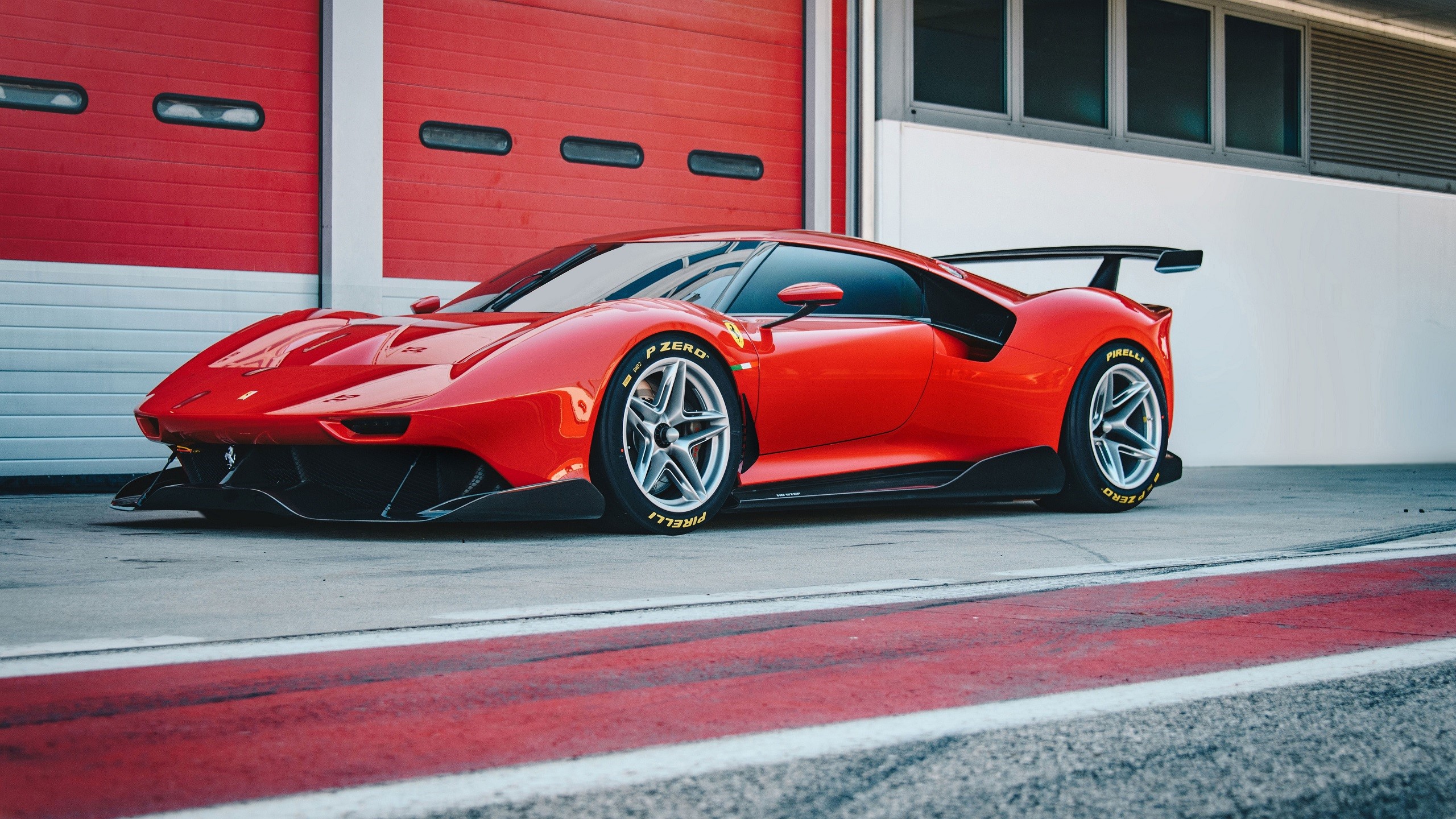 Red Ferrari P80/C sports car on a track HD Wallpaper