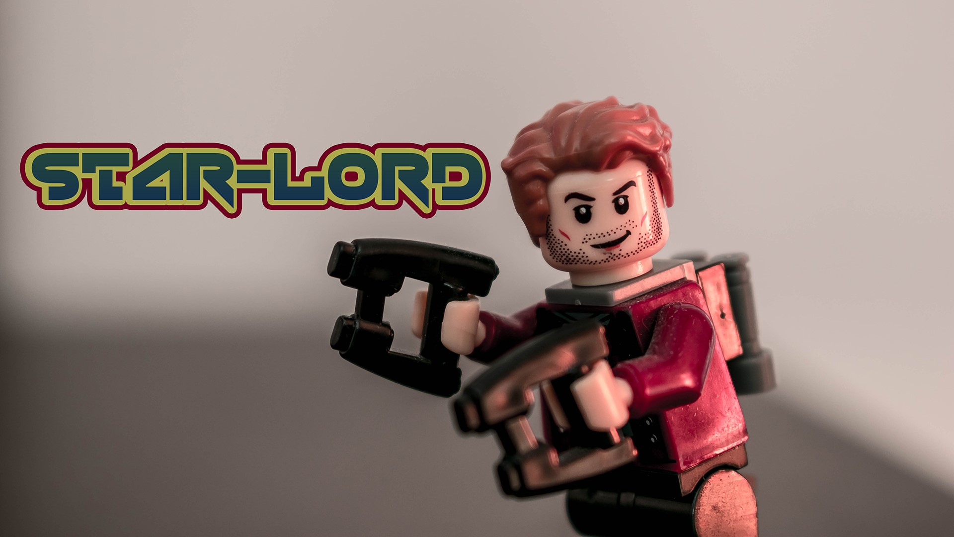 Star-Lord LEGO minifigure with guns HD Wallpaper