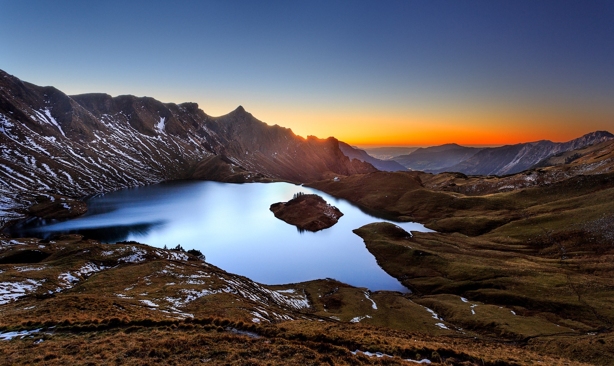 Mountain lake at sunset with island HD Wallpaper
