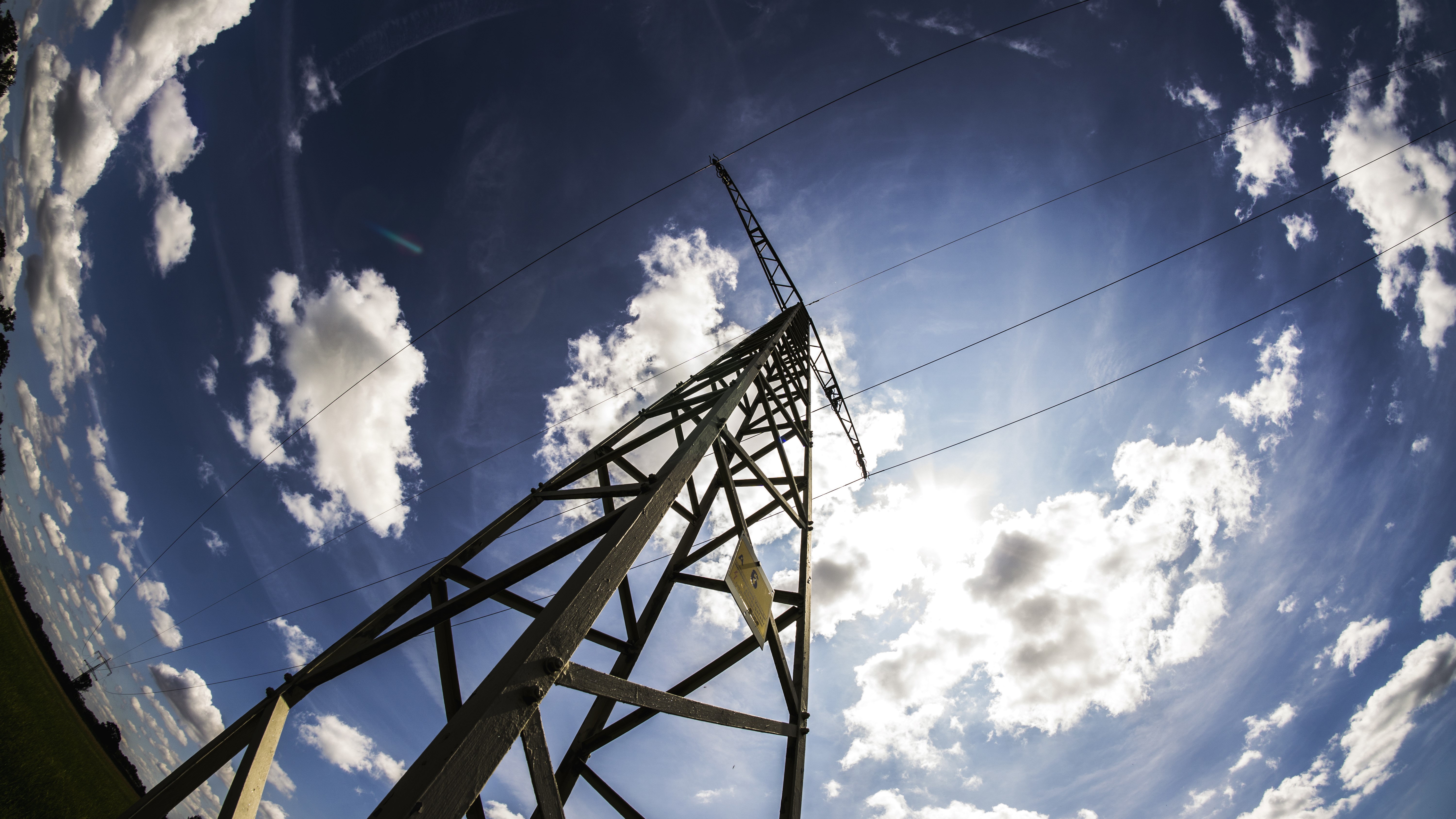 Power lines and clouds against blue sky HD Wallpaper