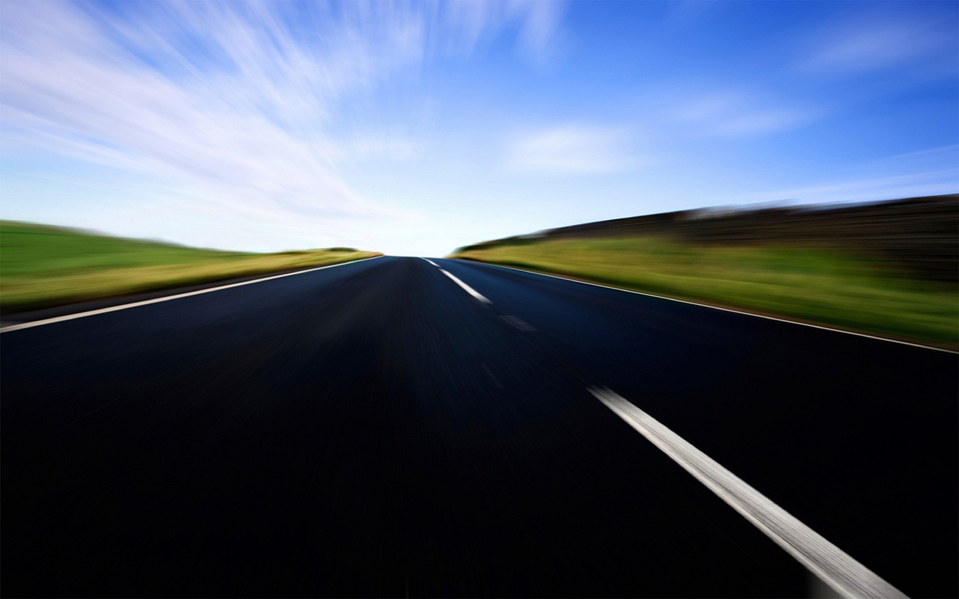 Road with motion blur under a blue sky HD Wallpaper