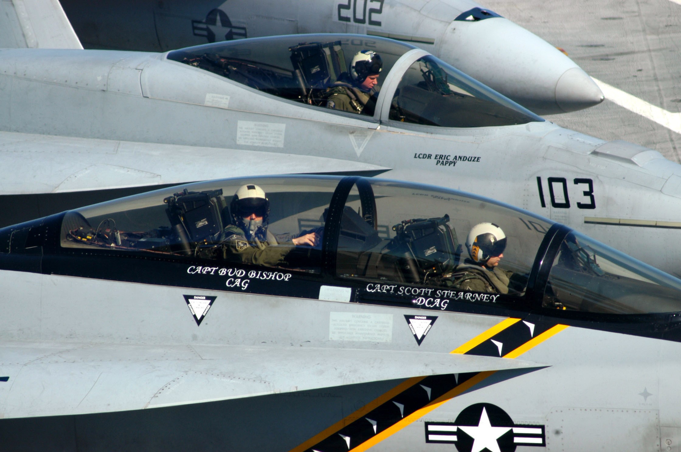 Two Boeing F/A-18E/F Super Hornets on an aircraft carrier HD Wallpaper