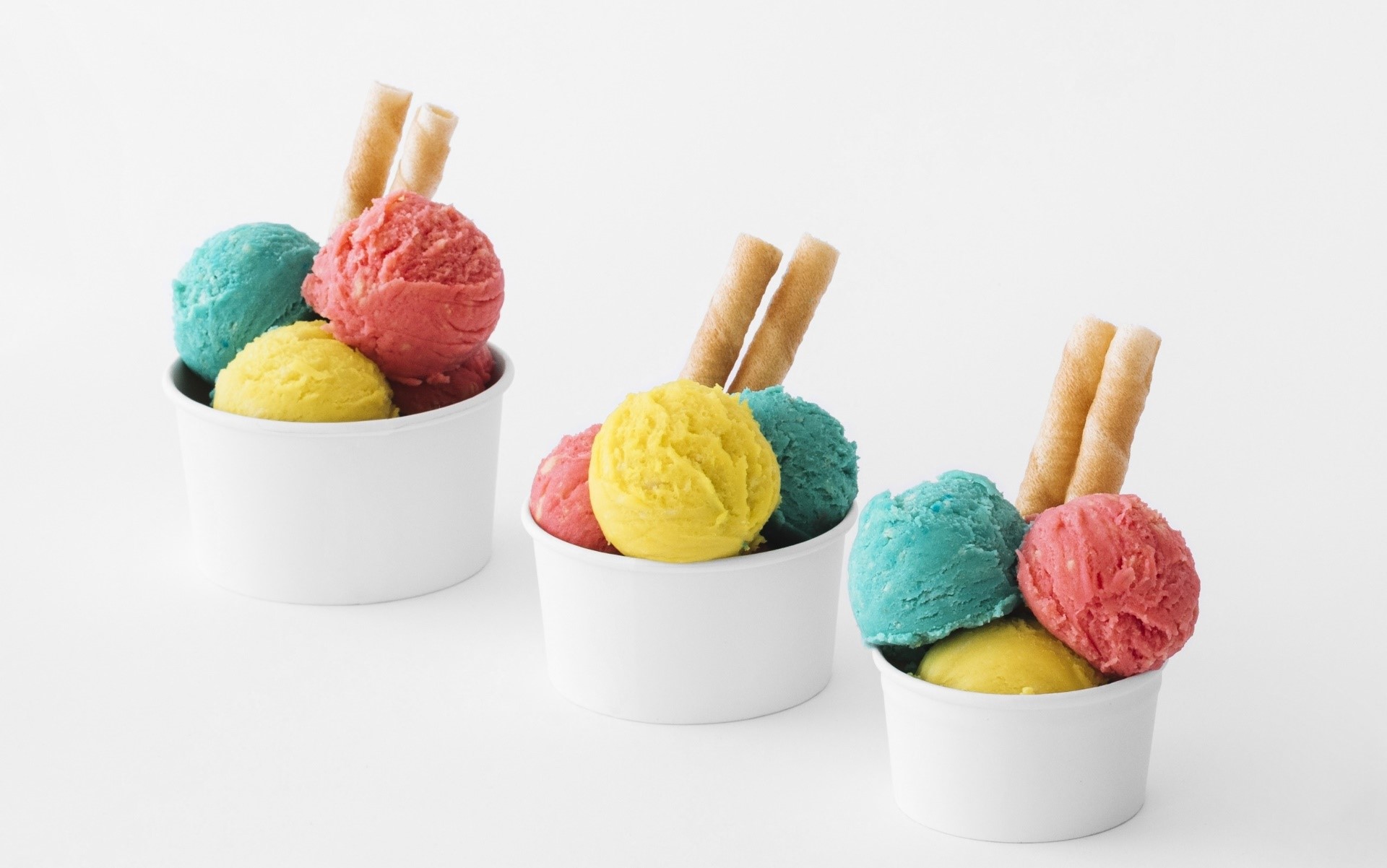 Three cups of colorful ice cream with wafer sticks HD Wallpaper