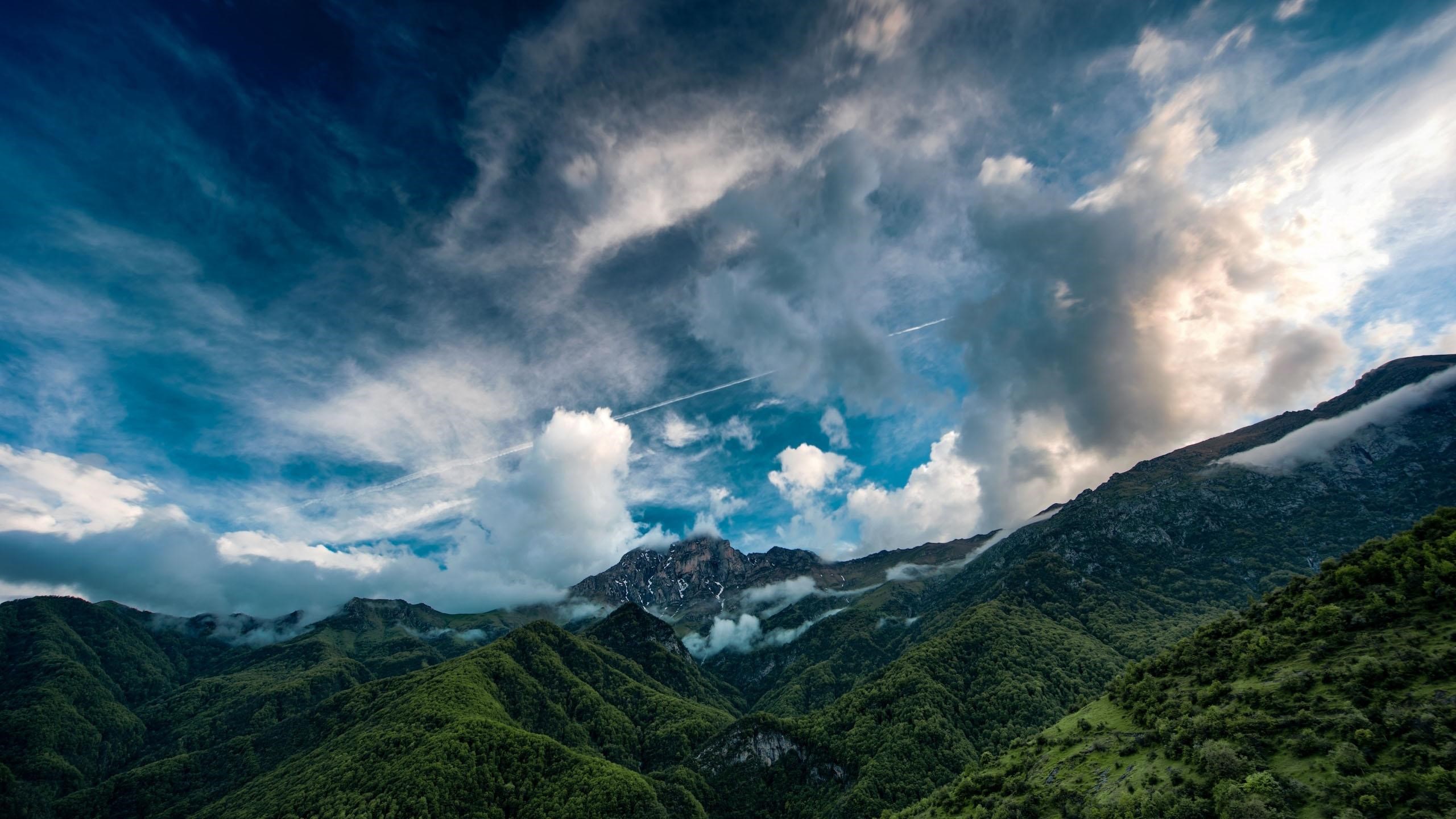 Dramatic sky over green mountains HD Wallpaper