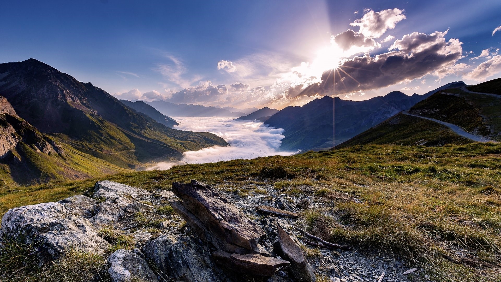 Mountain valley with mist and sun rays HD Wallpaper