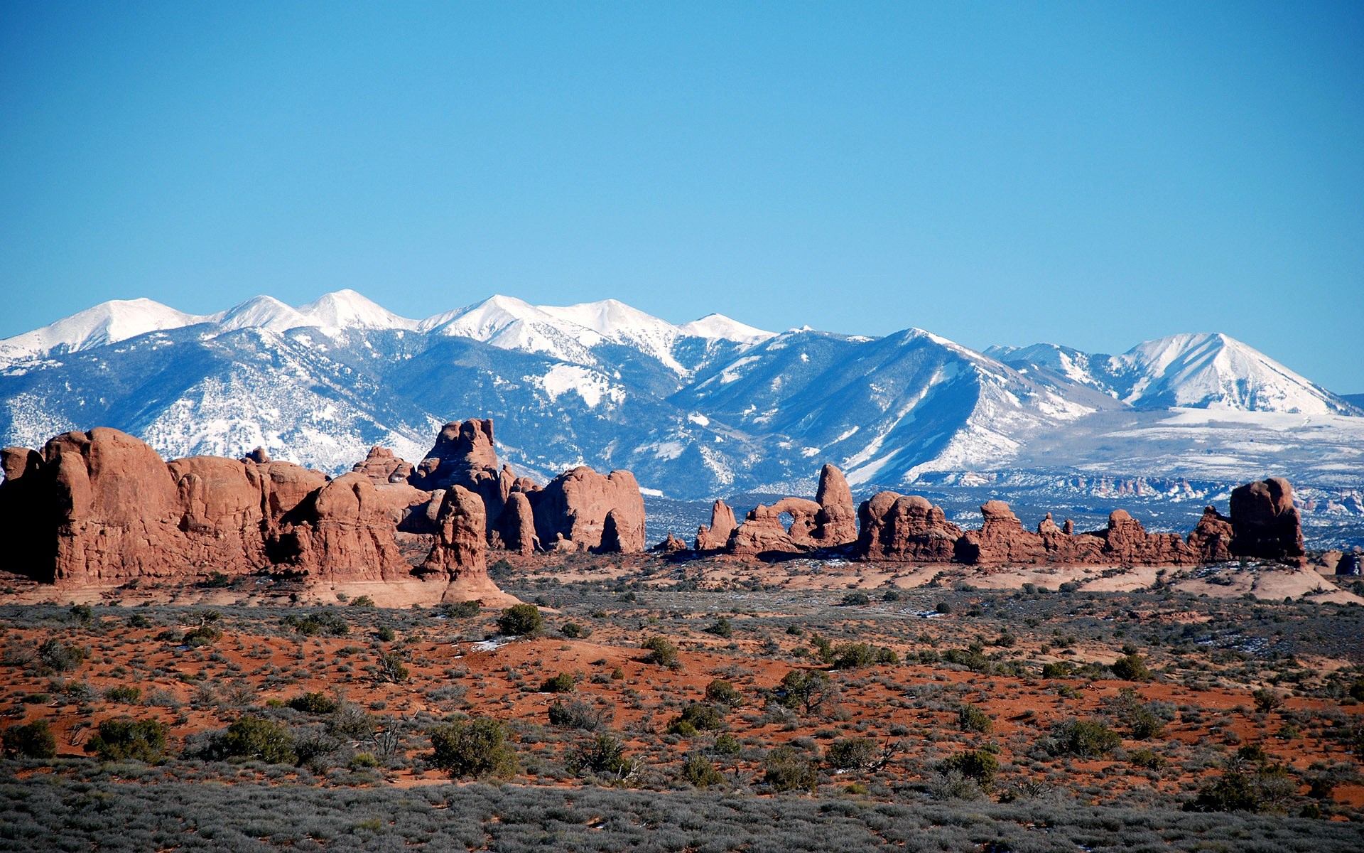 Arches National Park with snow-capped mountains HD Wallpaper