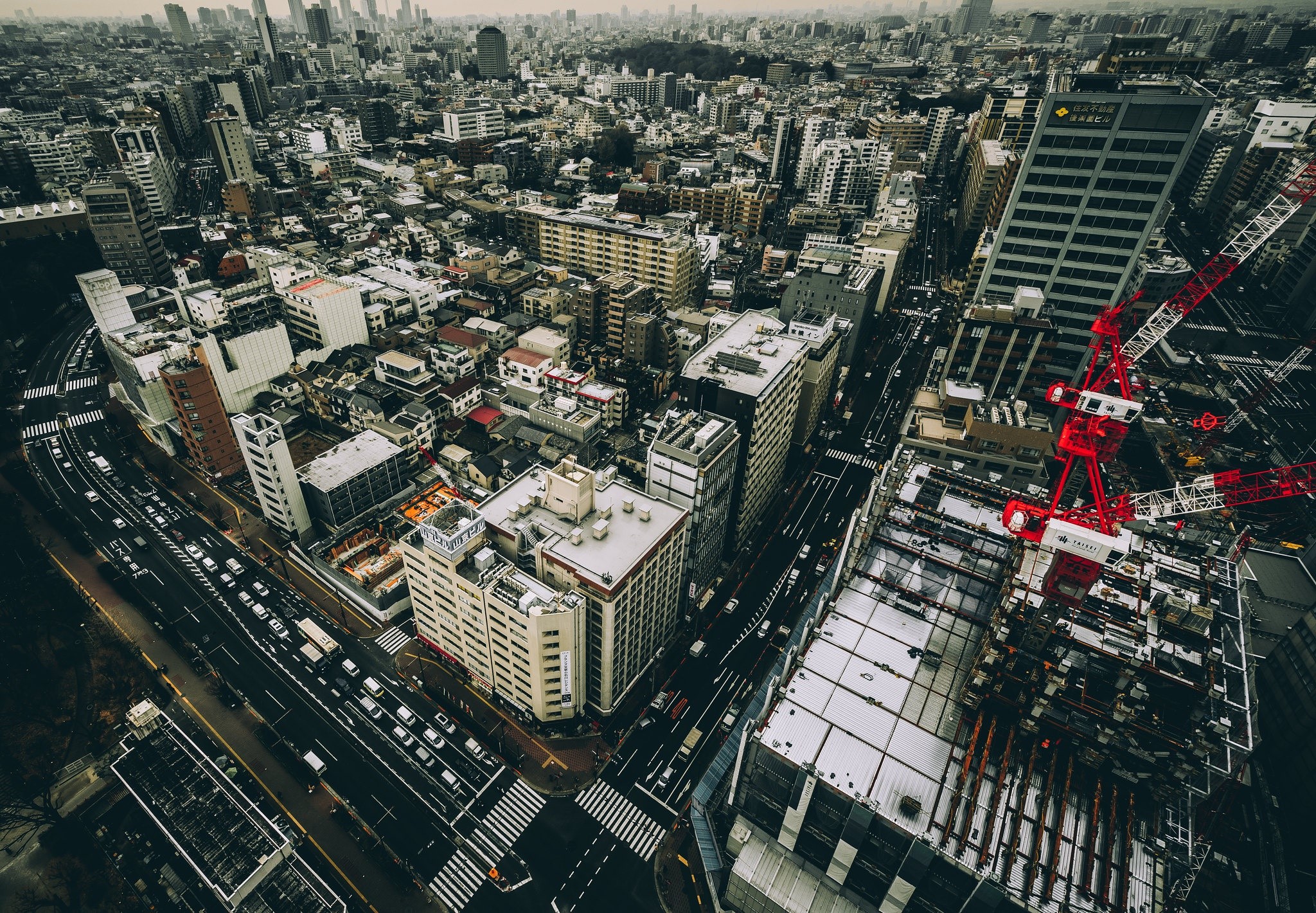 Aerial view of Tokyo cityscape with construction crane HD Wallpaper