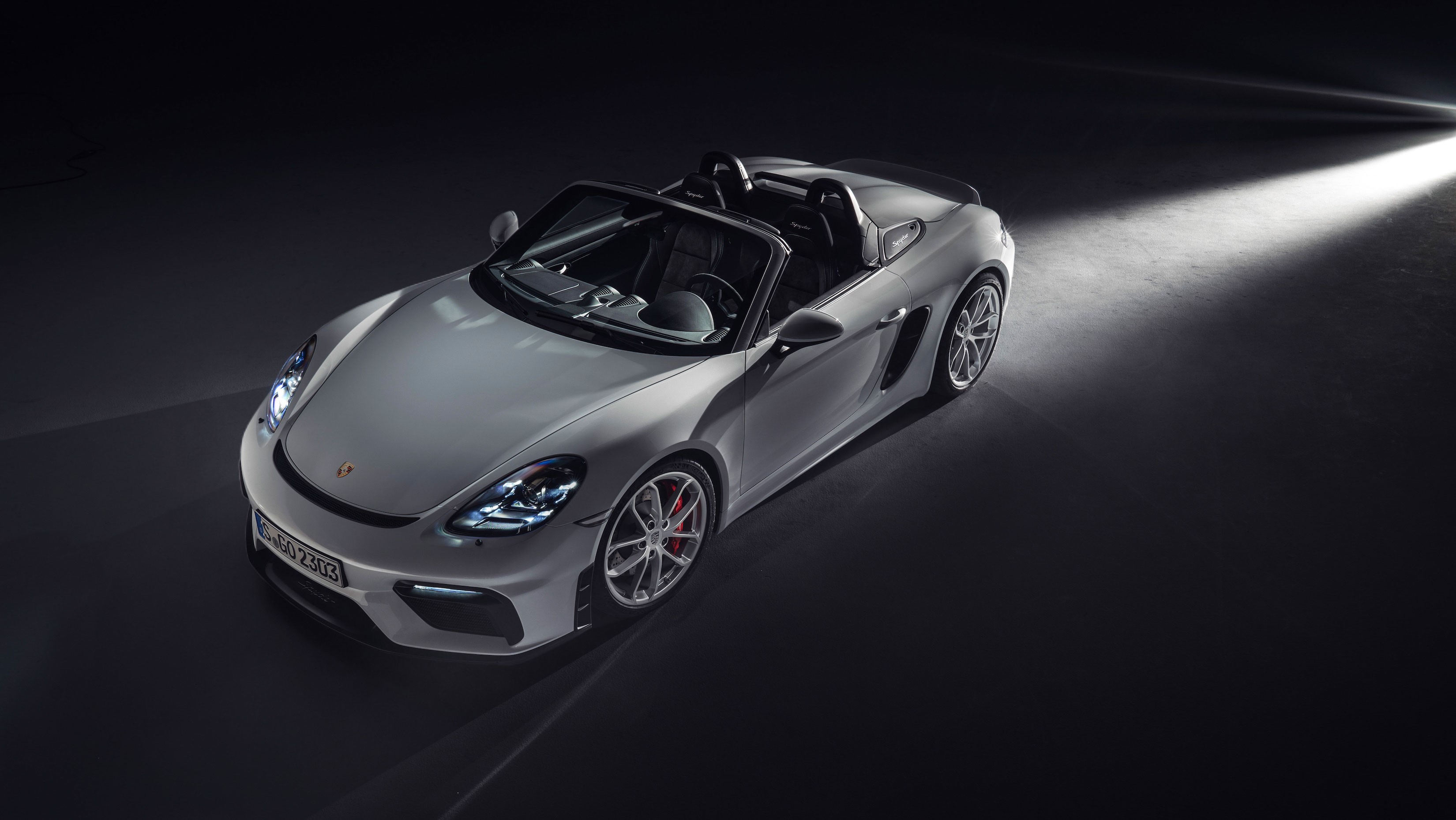 Porsche 718 Spyder sports car with headlights on HD Wallpaper