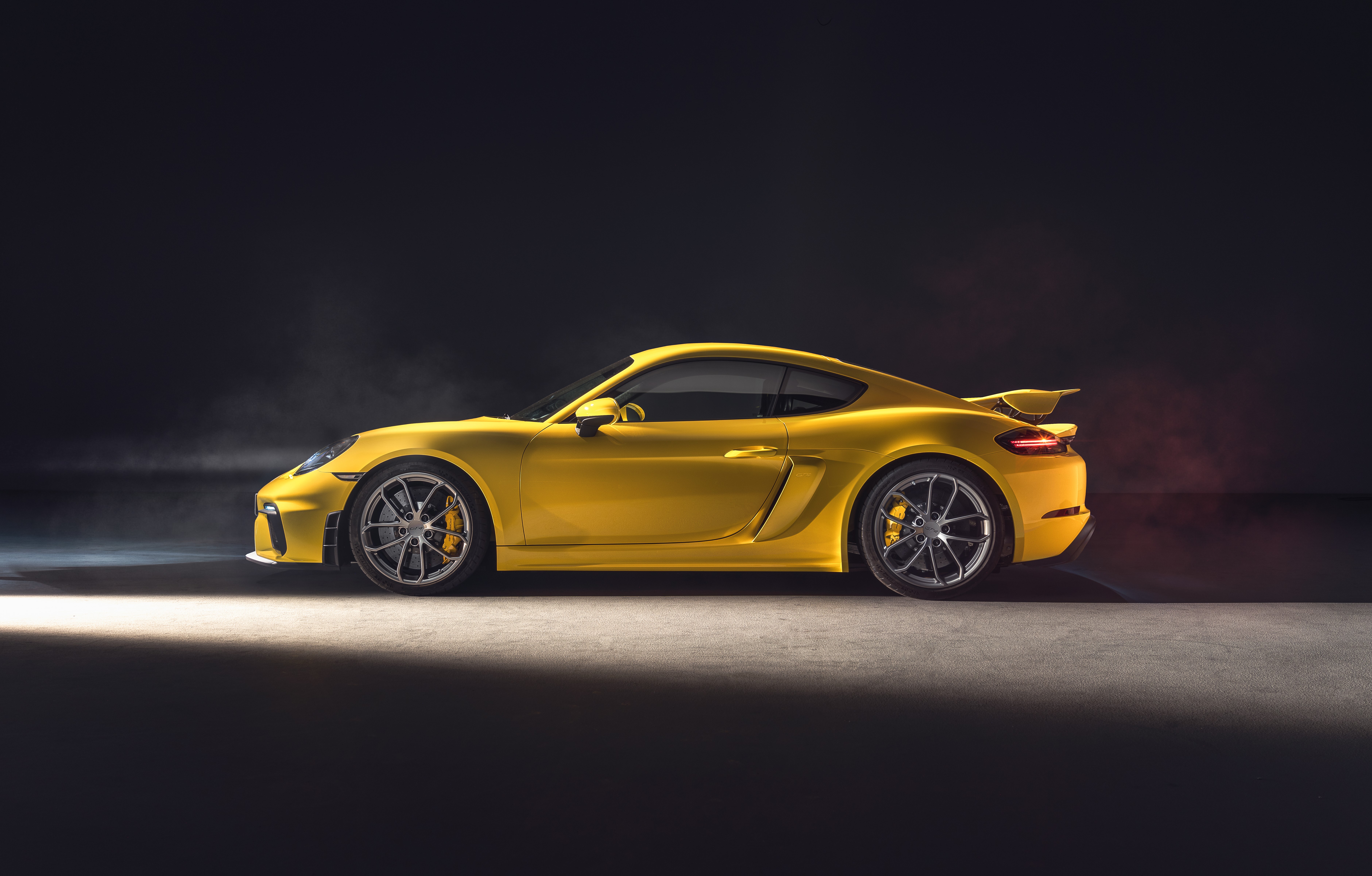 Yellow Porsche 718 Cayman sports car side view HD Wallpaper