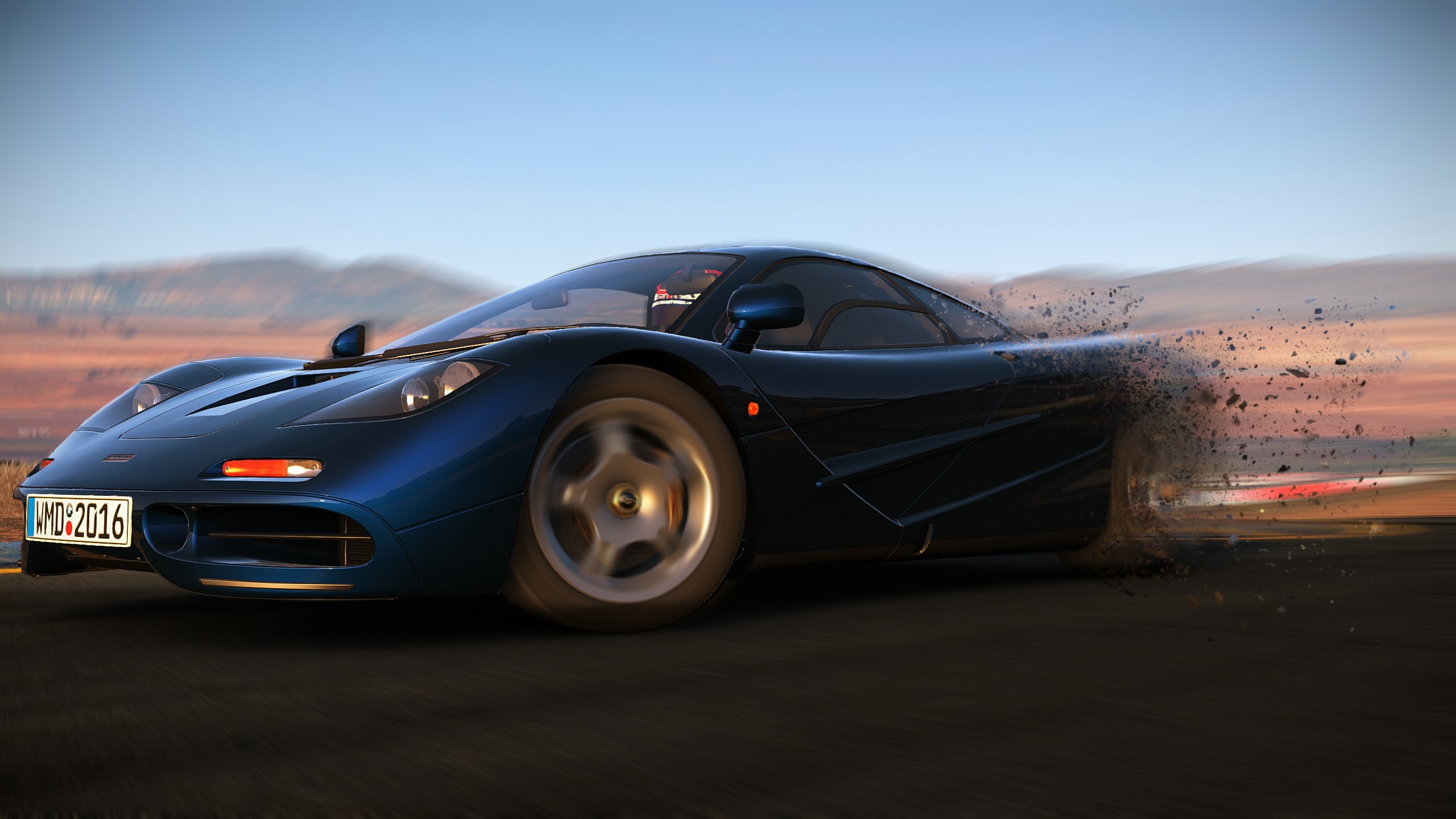 Blue McLaren F1 car with license plate WMD:2016 HD Wallpaper
