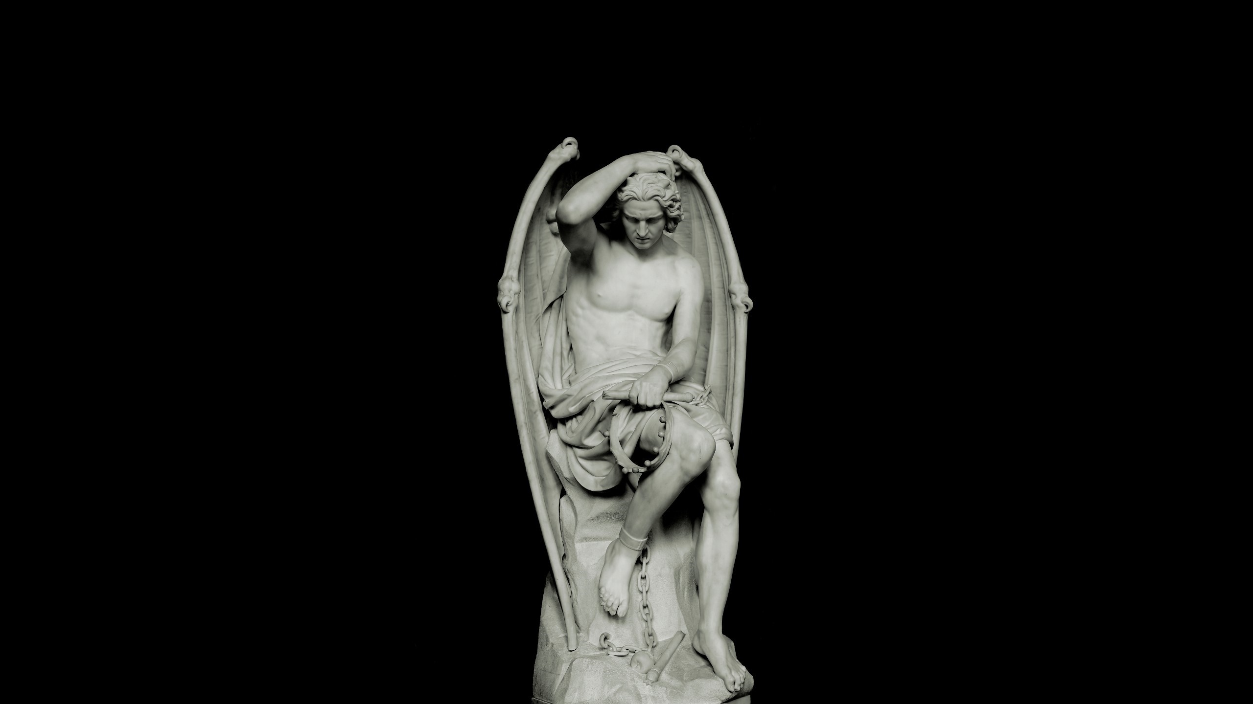 Statue of a winged figure chained HD Wallpaper
