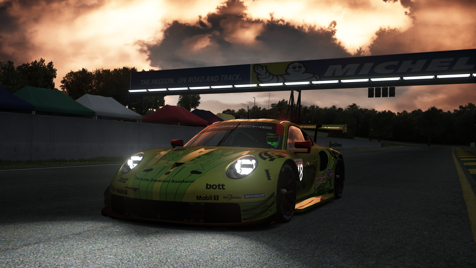 Porsche 911 RSR on a race track under a cloudy sky HD Wallpaper
