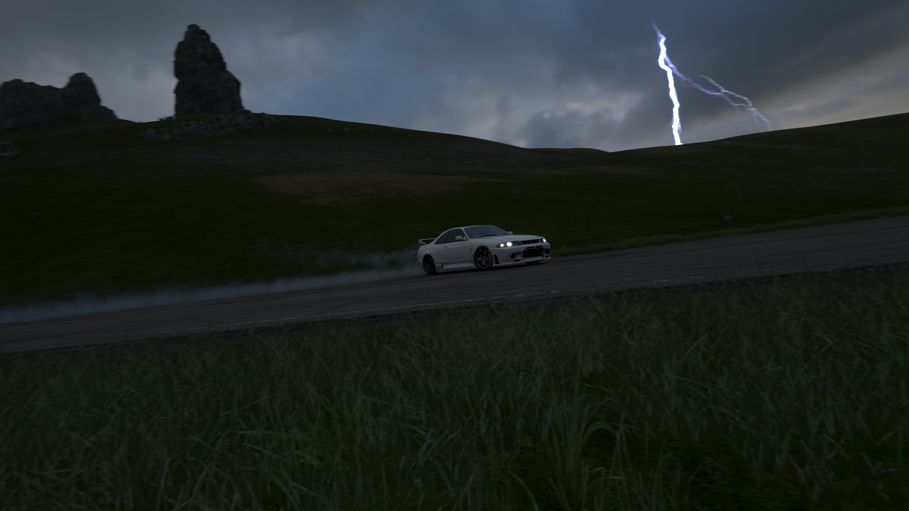 White car drifting on a road during a thunderstorm in Forza Horizon 4 HD Wallpaper