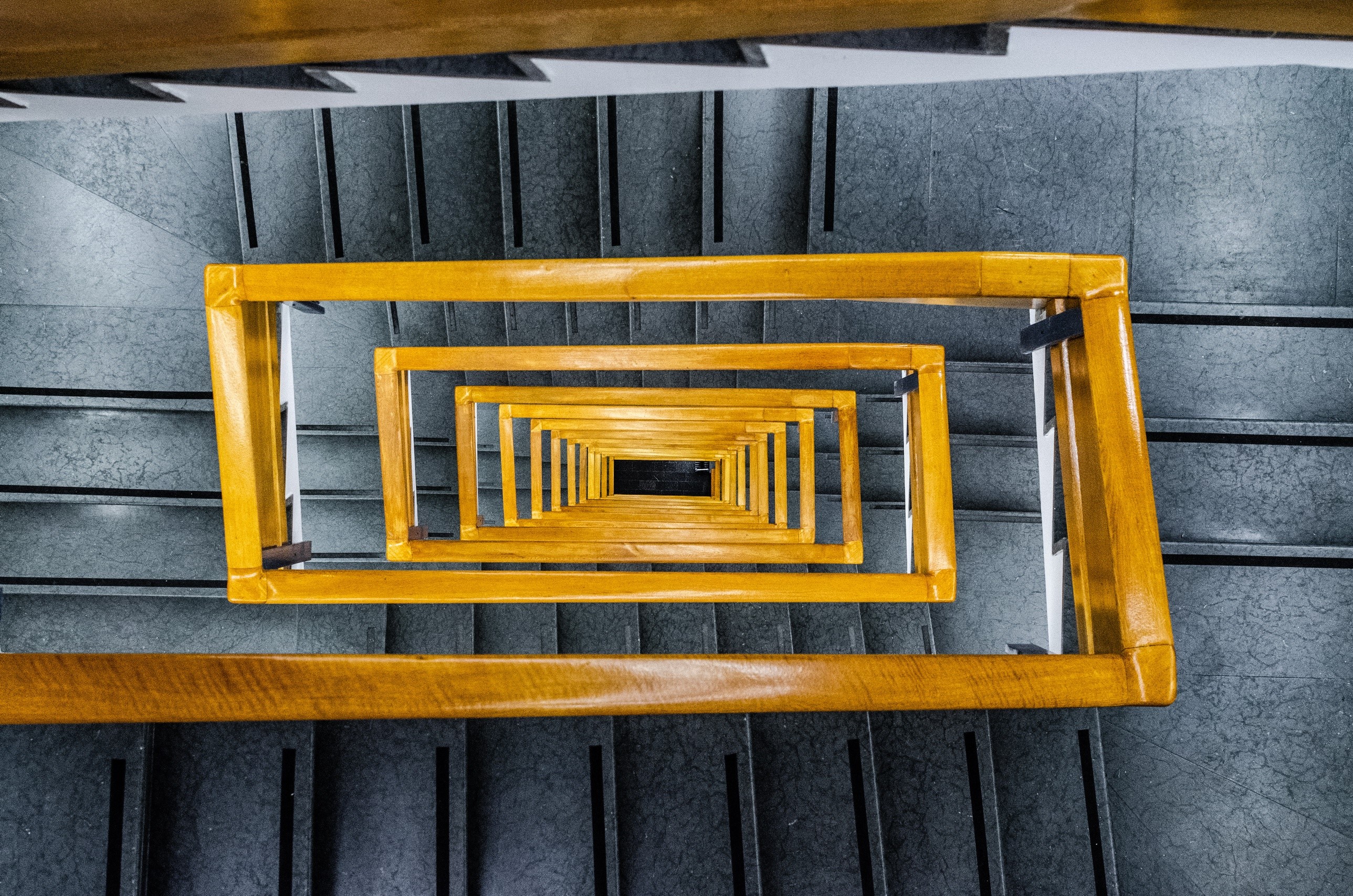 Yellow handrails on a spiral staircase HD Wallpaper