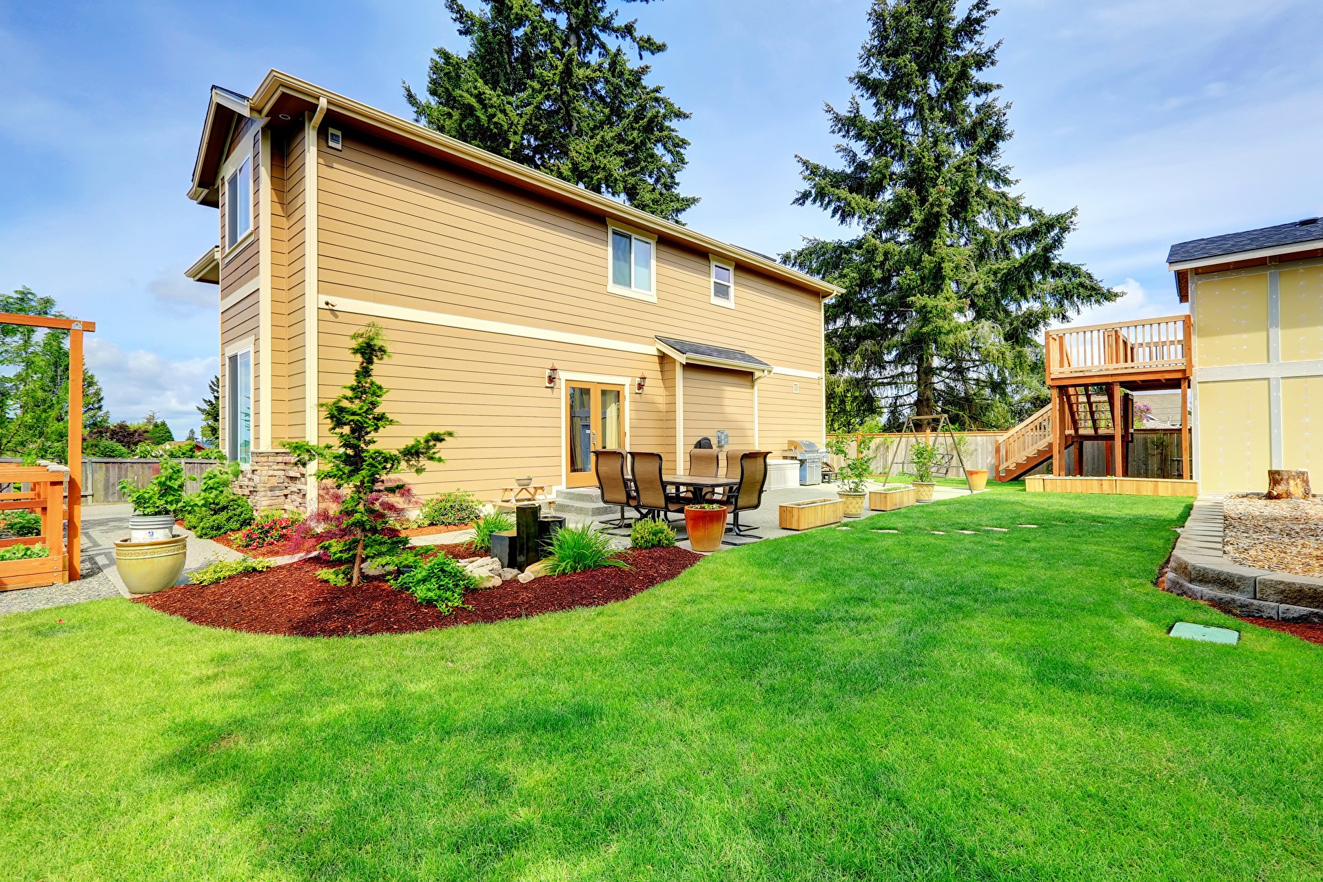 Backyard with a two-story house and deck HD Wallpaper