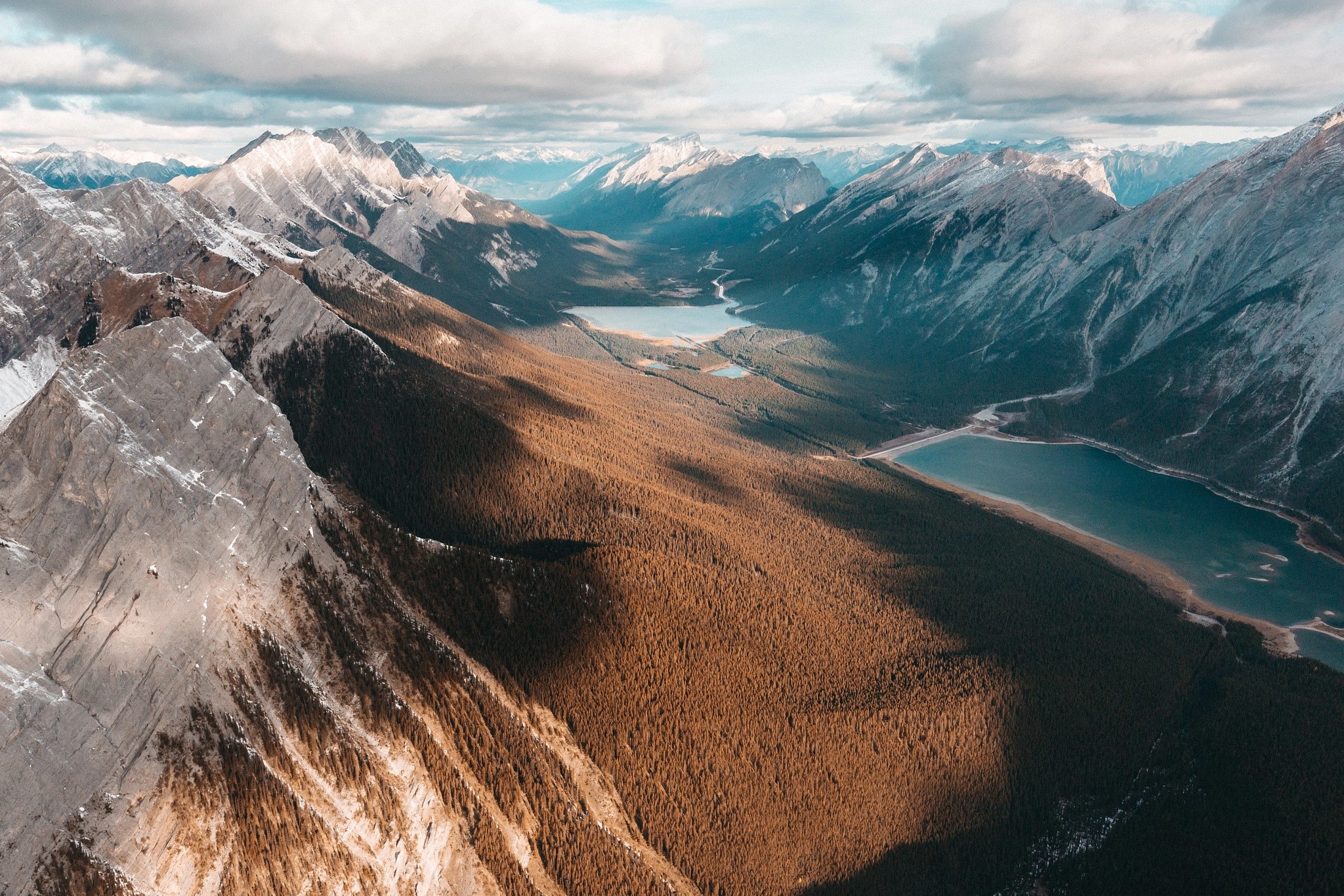 Aerial view of a mountain valley with lakes and forests HD Wallpaper