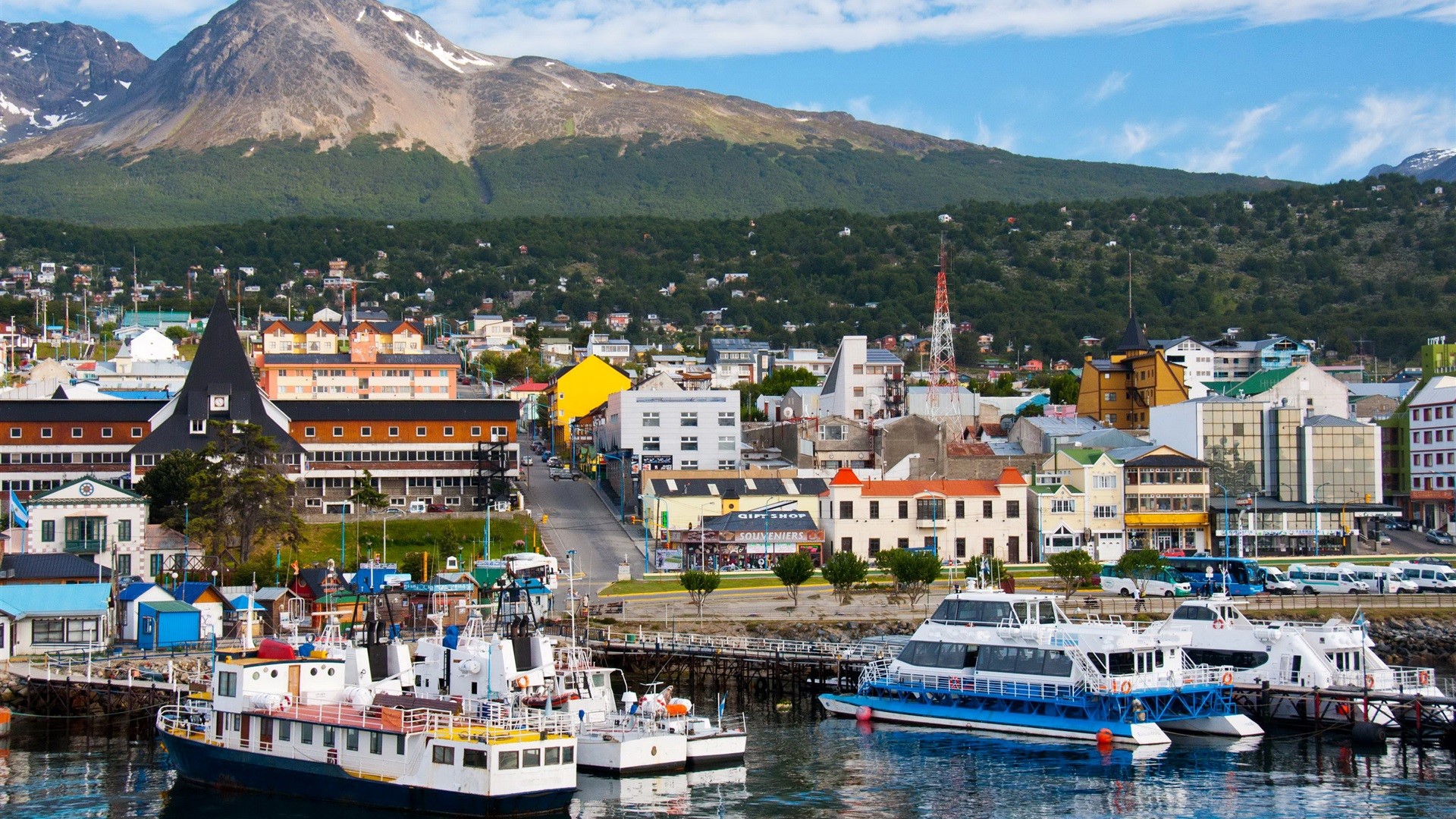 Boats docked in Ushuaia, Patagonia with mountains in background HD Wallpaper