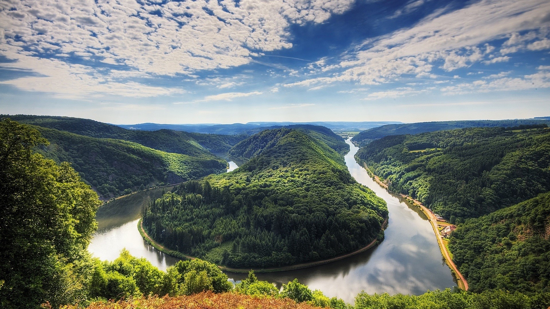 Saarschleife river bend in Germany with green forests and clouds HD Wallpaper
