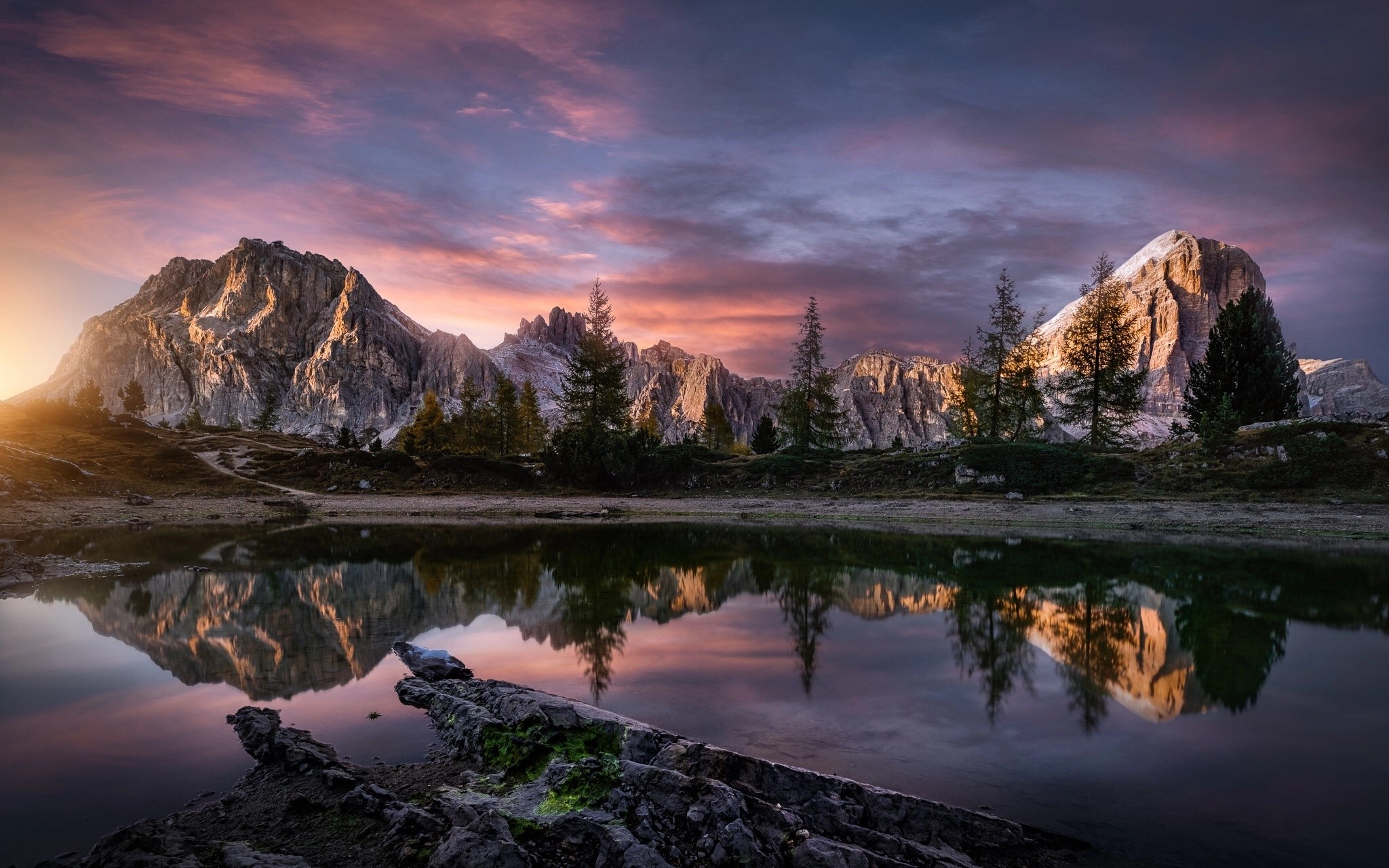 Mountain range reflected in a lake at sunset HD Wallpaper
