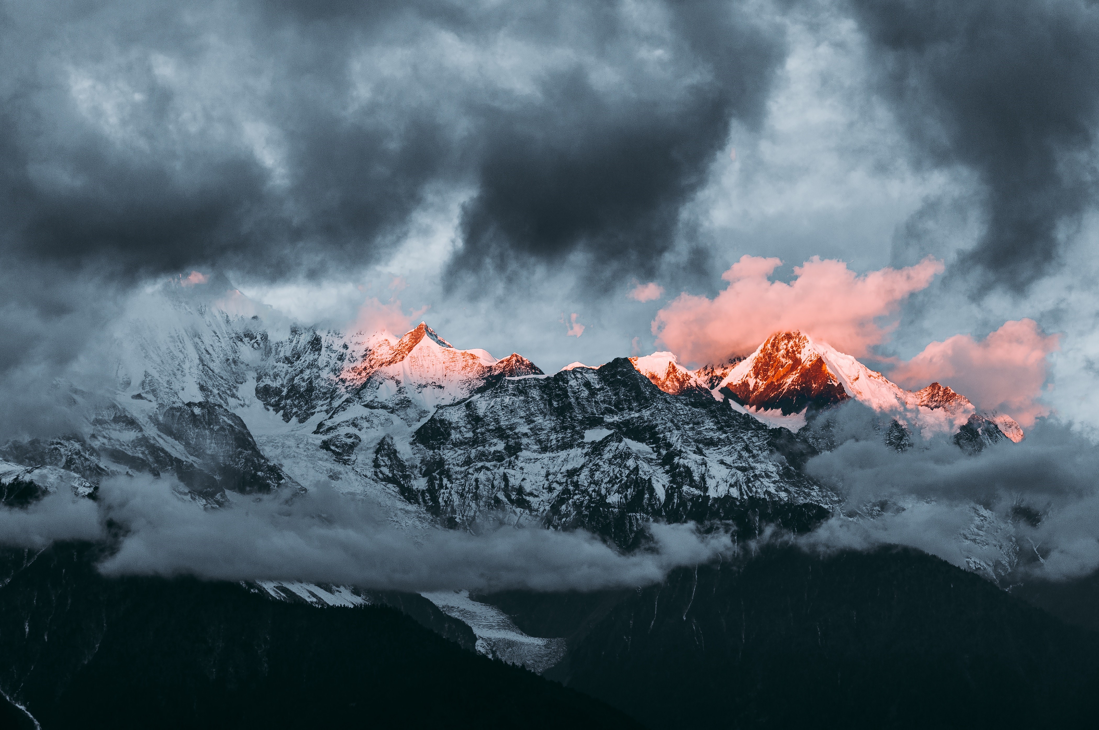 4K Mountain Peaks Under Dramatic Clouds HD Wallpaper