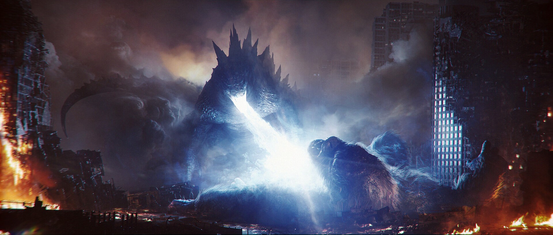 Godzilla and King Kong battling in a destroyed city HD Wallpaper
