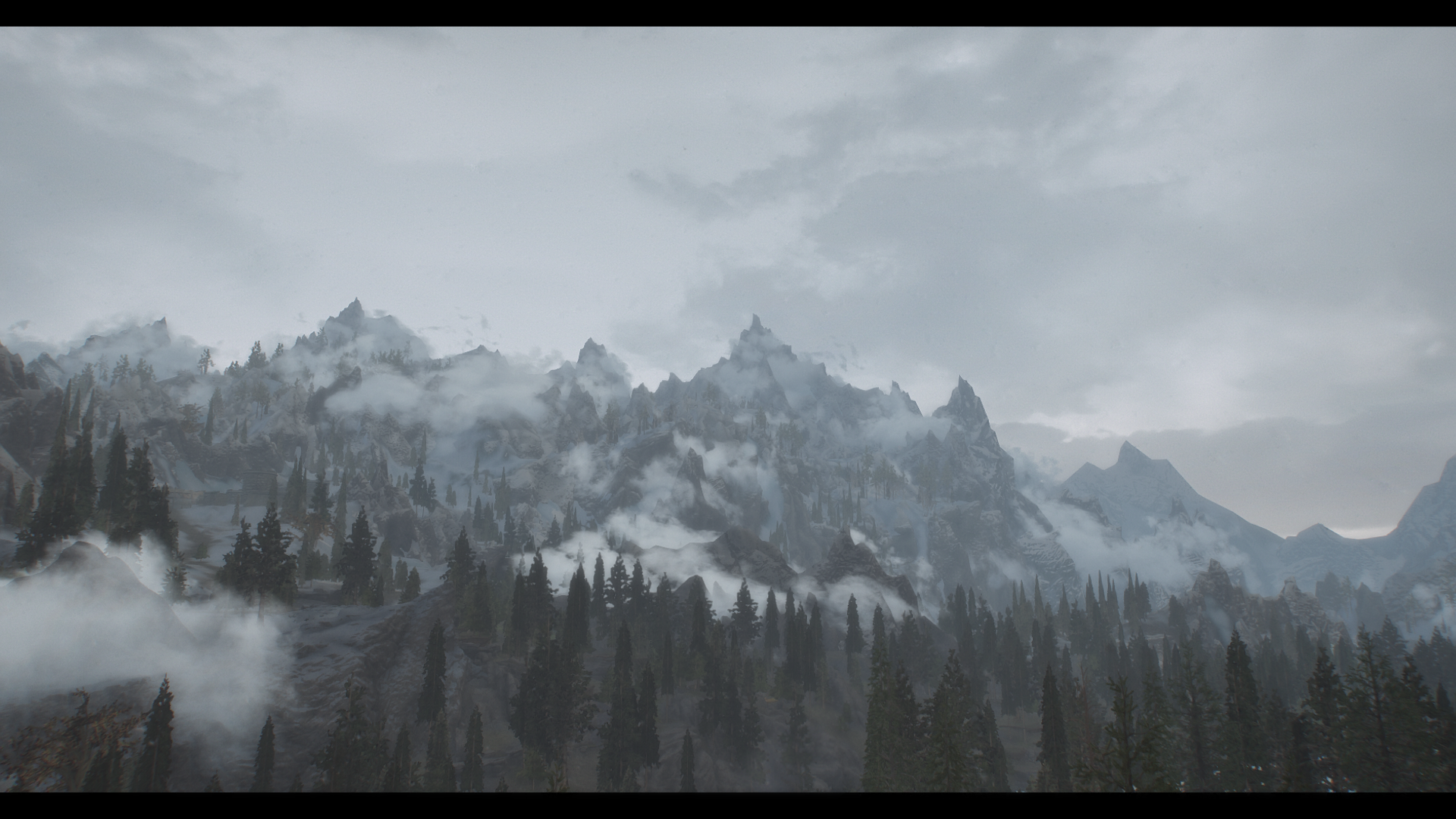 The Elder Scrolls V: Skyrim mountains with fog and trees HD Wallpaper