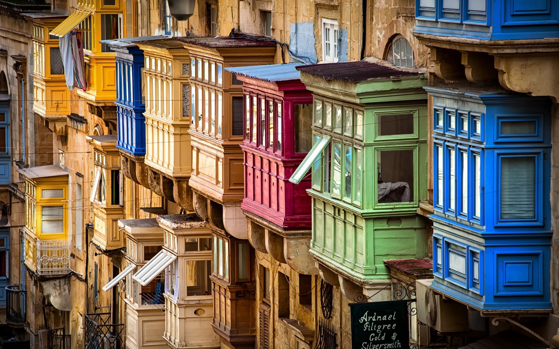 Colorful balconies on a building in Malta HD Wallpaper