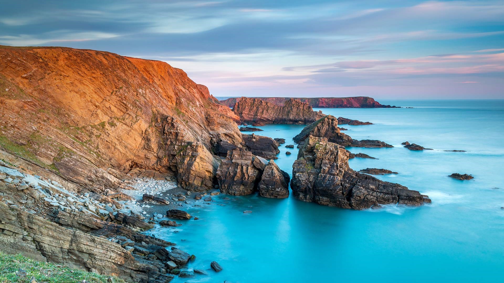 Rocky coastline and sea at Pitting Gales Point, Pembrokeshire, Wales HD Wallpaper