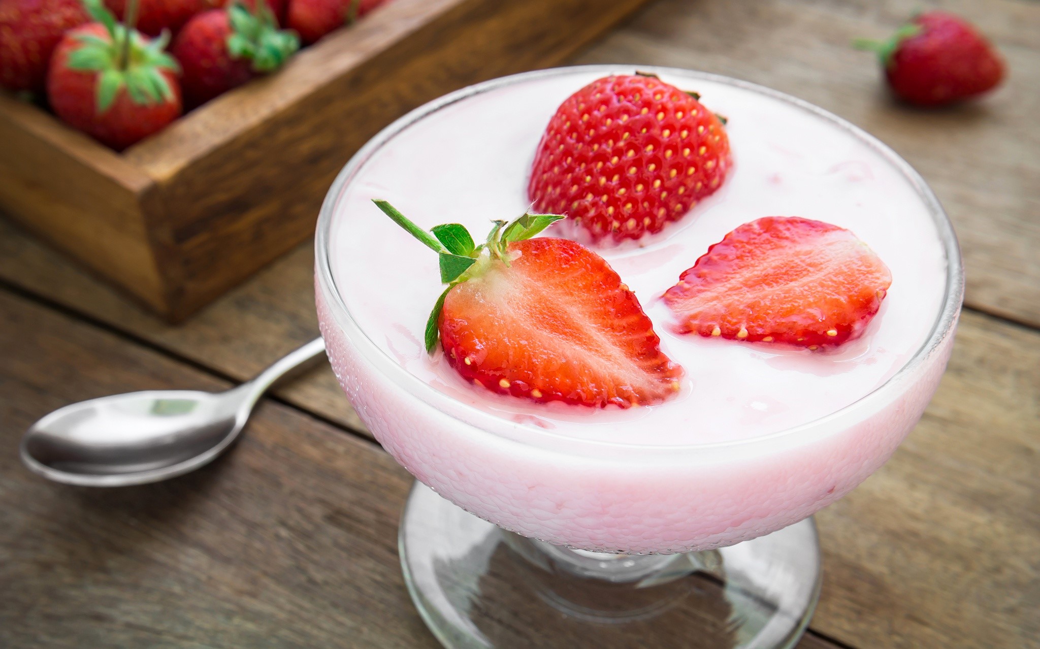 Strawberries and yogurt in a glass bowl with a spoon HD Wallpaper