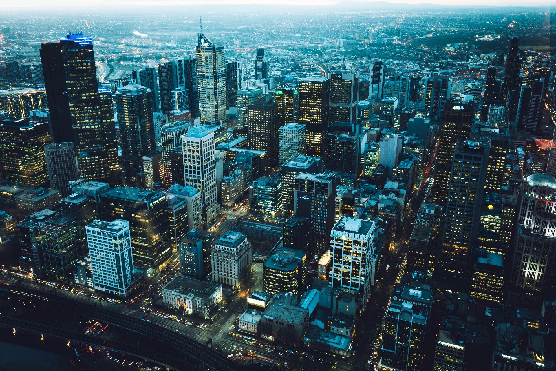 Aerial view of Melbourne cityscape at dusk with city lights HD Wallpaper