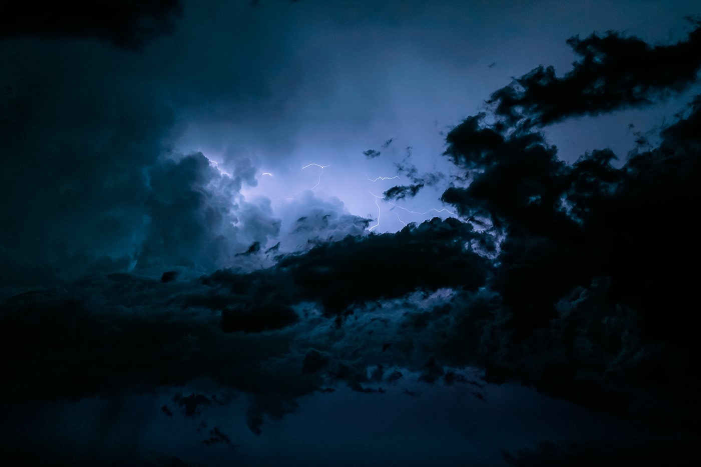 Lightning strikes through dark storm clouds HD Wallpaper