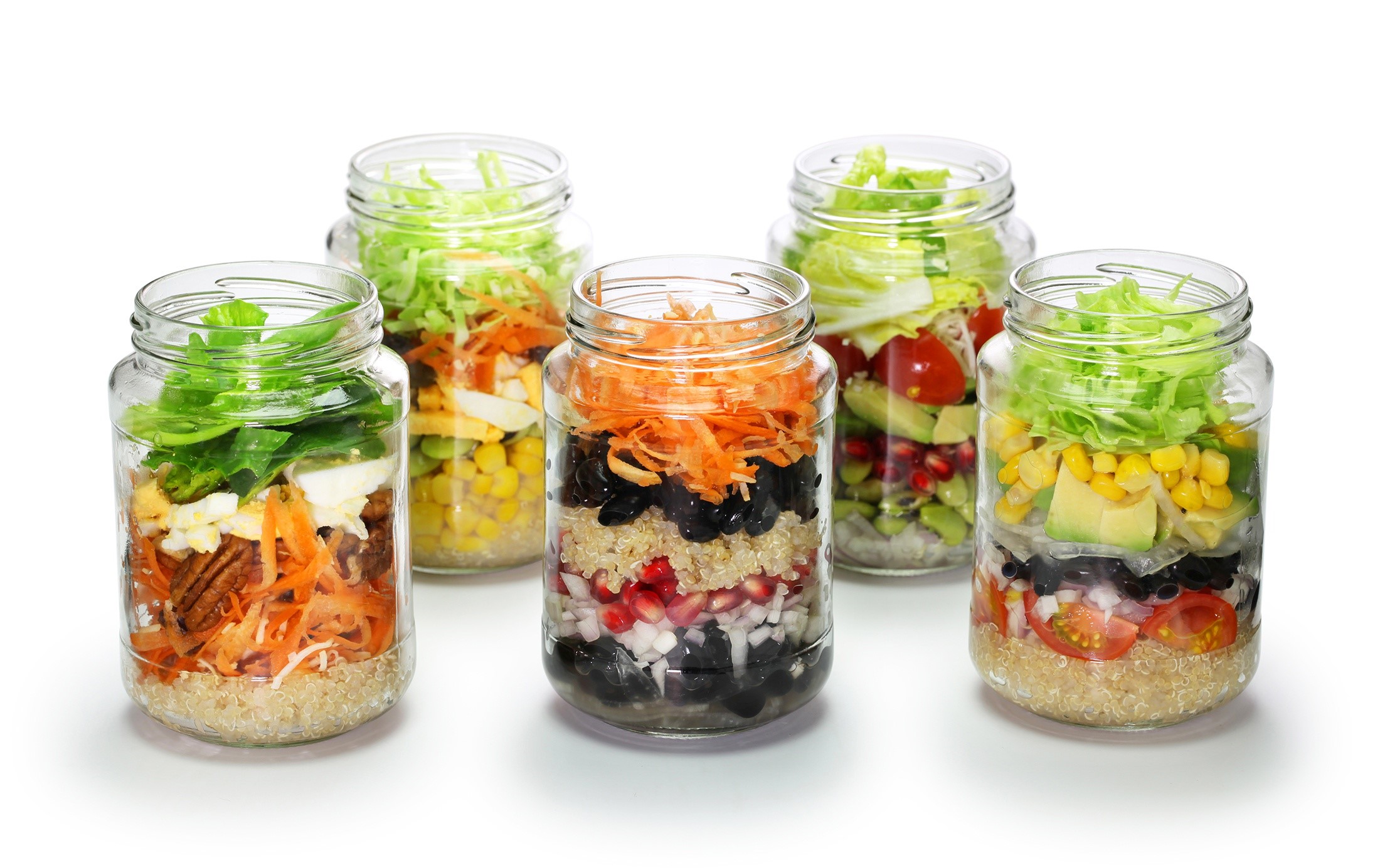Five layered salads in glass jars on a white background HD Wallpaper