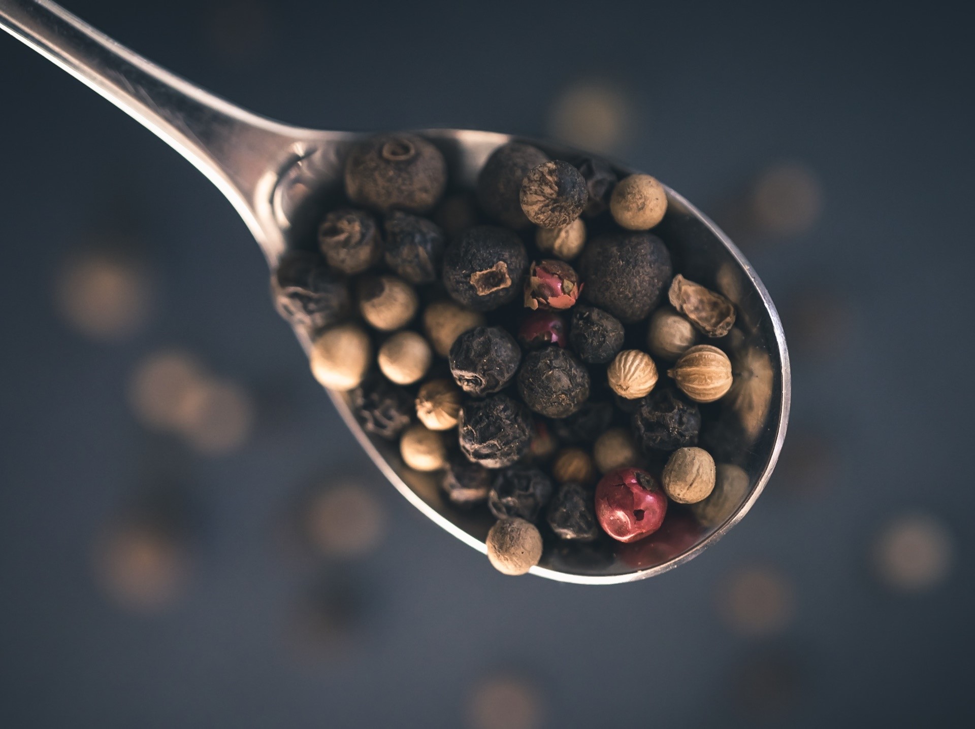 Spoonful of mixed peppercorns and spices HD Wallpaper