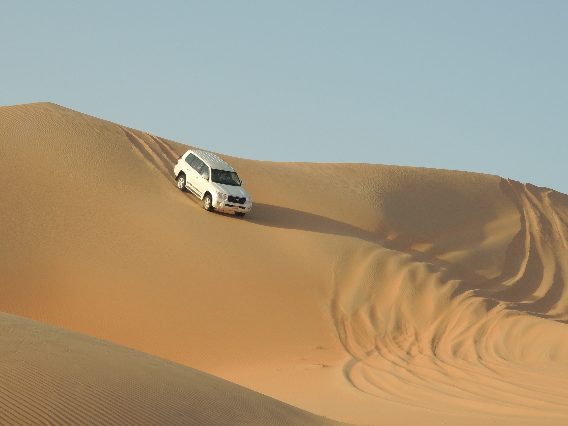 White Toyota Land Cruiser driving on sand dunes HD Wallpaper