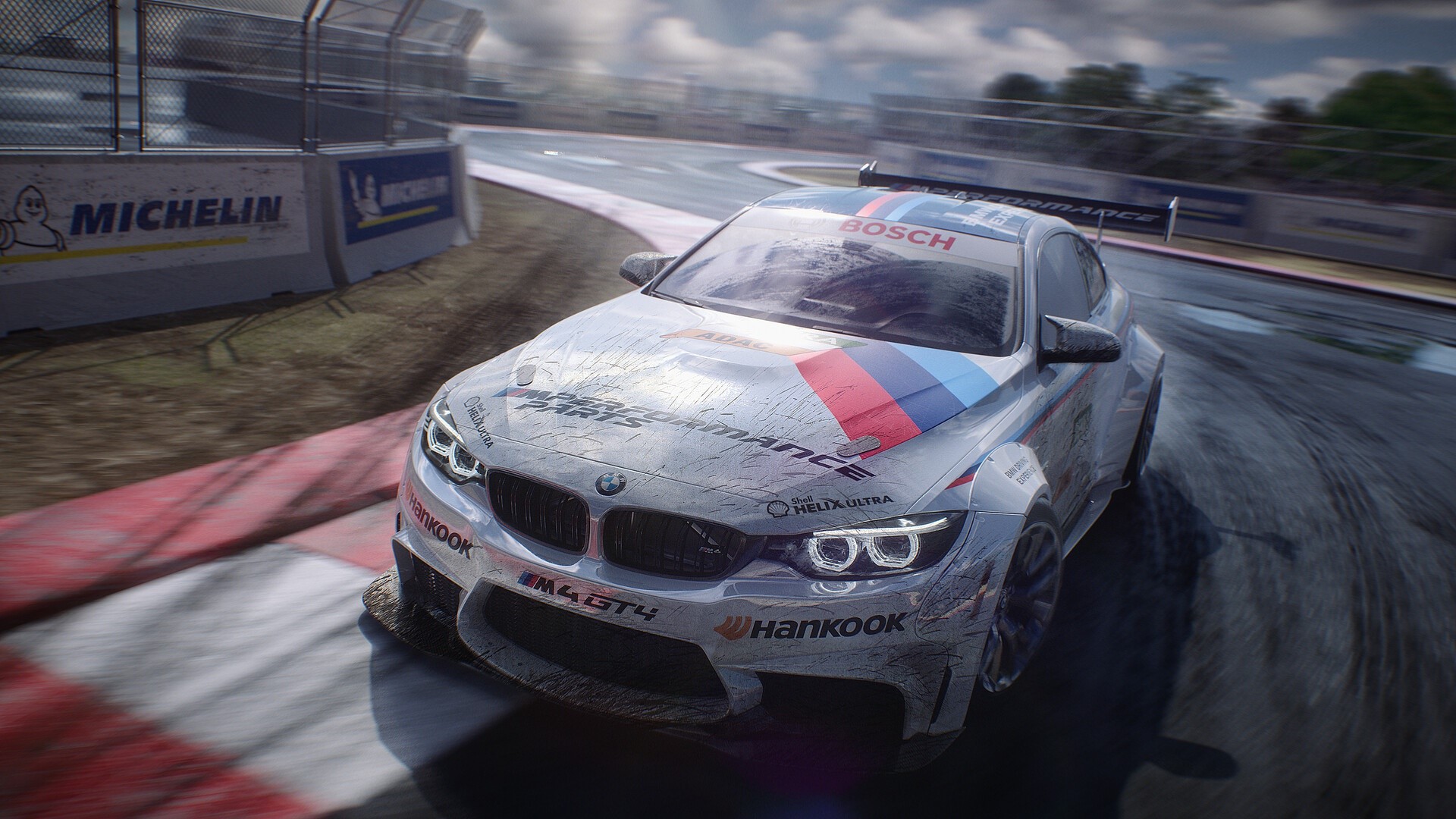 BMW M4 GT4 race car on a wet track HD Wallpaper