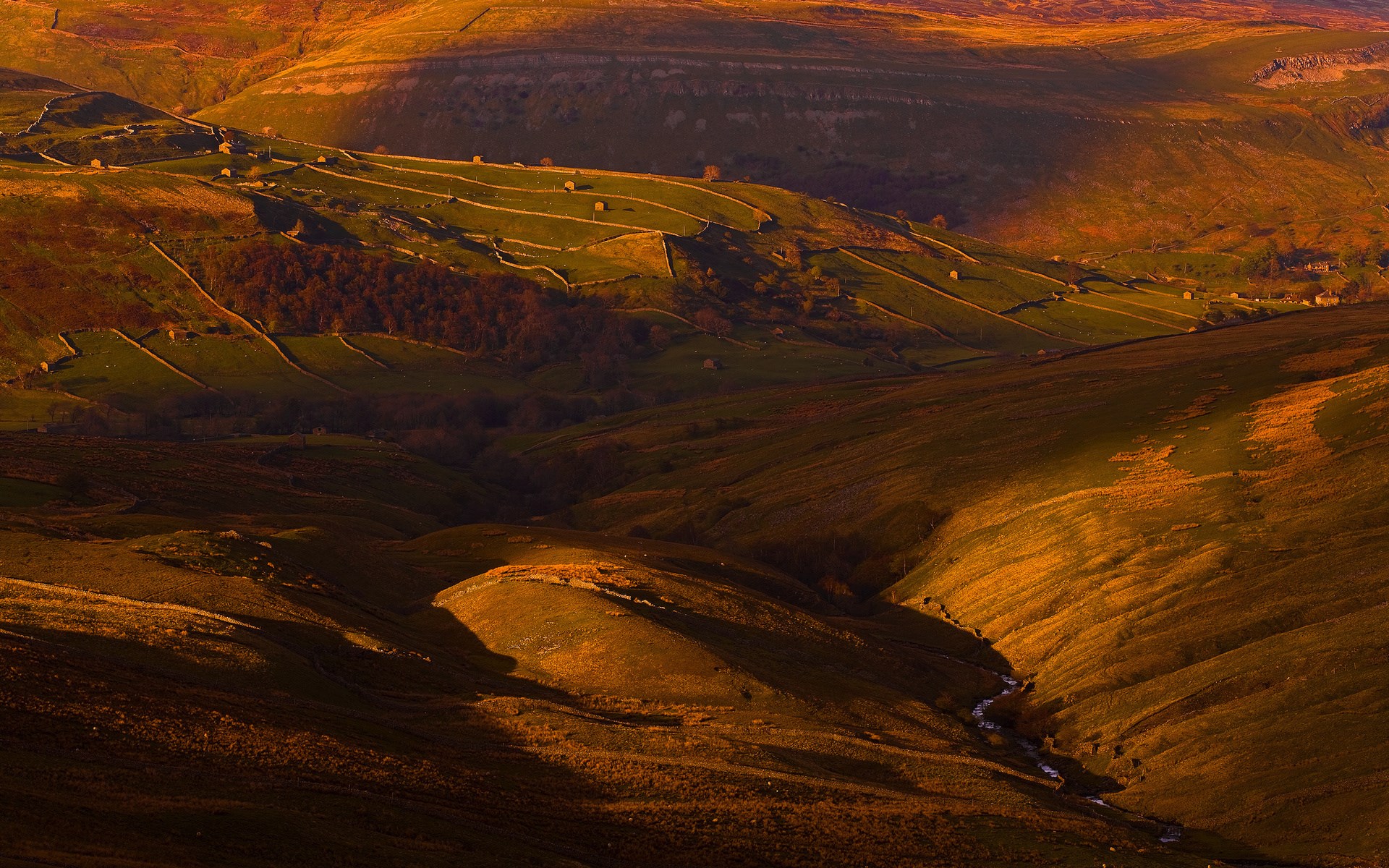 Rolling hills with stone walls and a stream HD Wallpaper