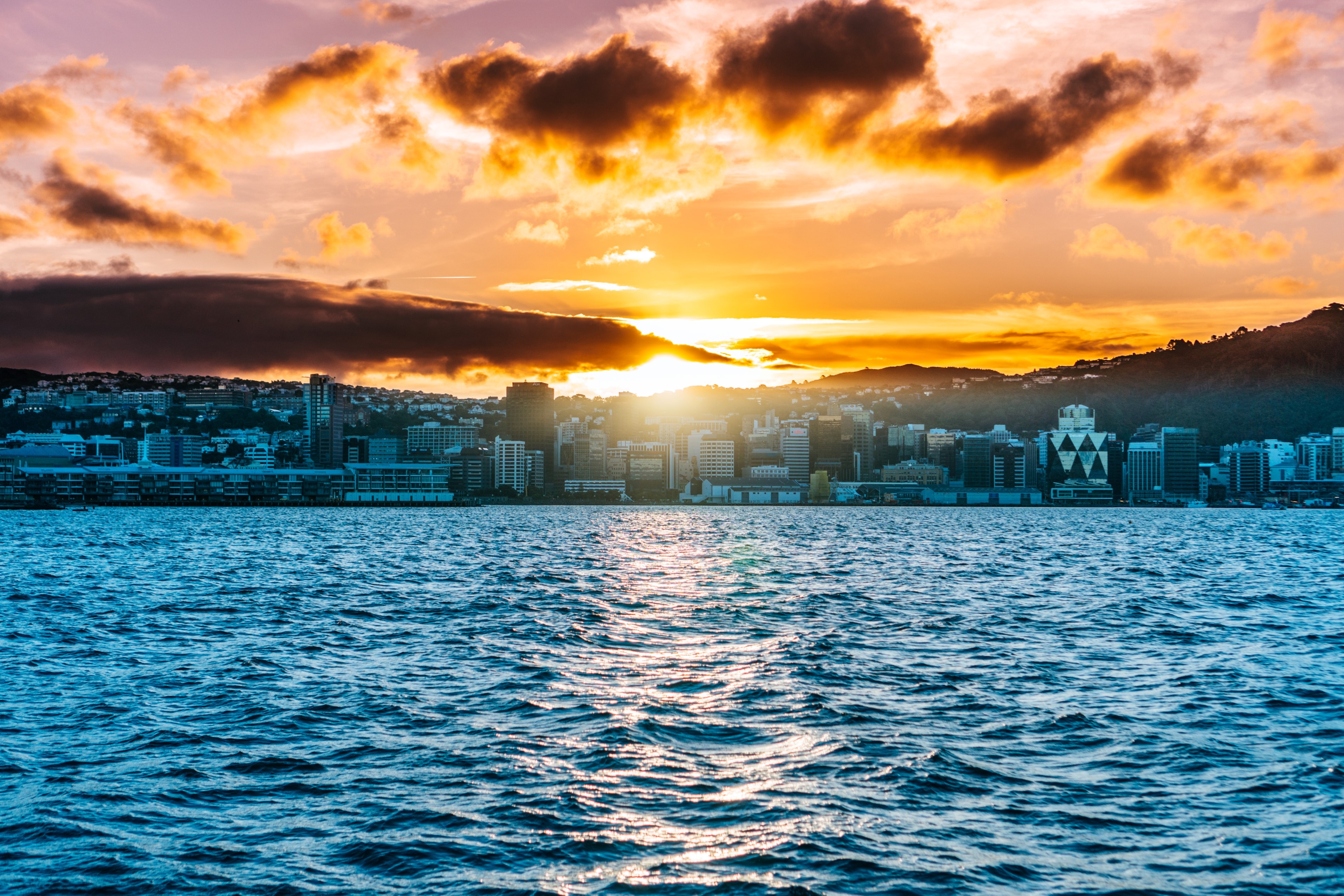 Wellington cityscape at sunset over the water HD Wallpaper
